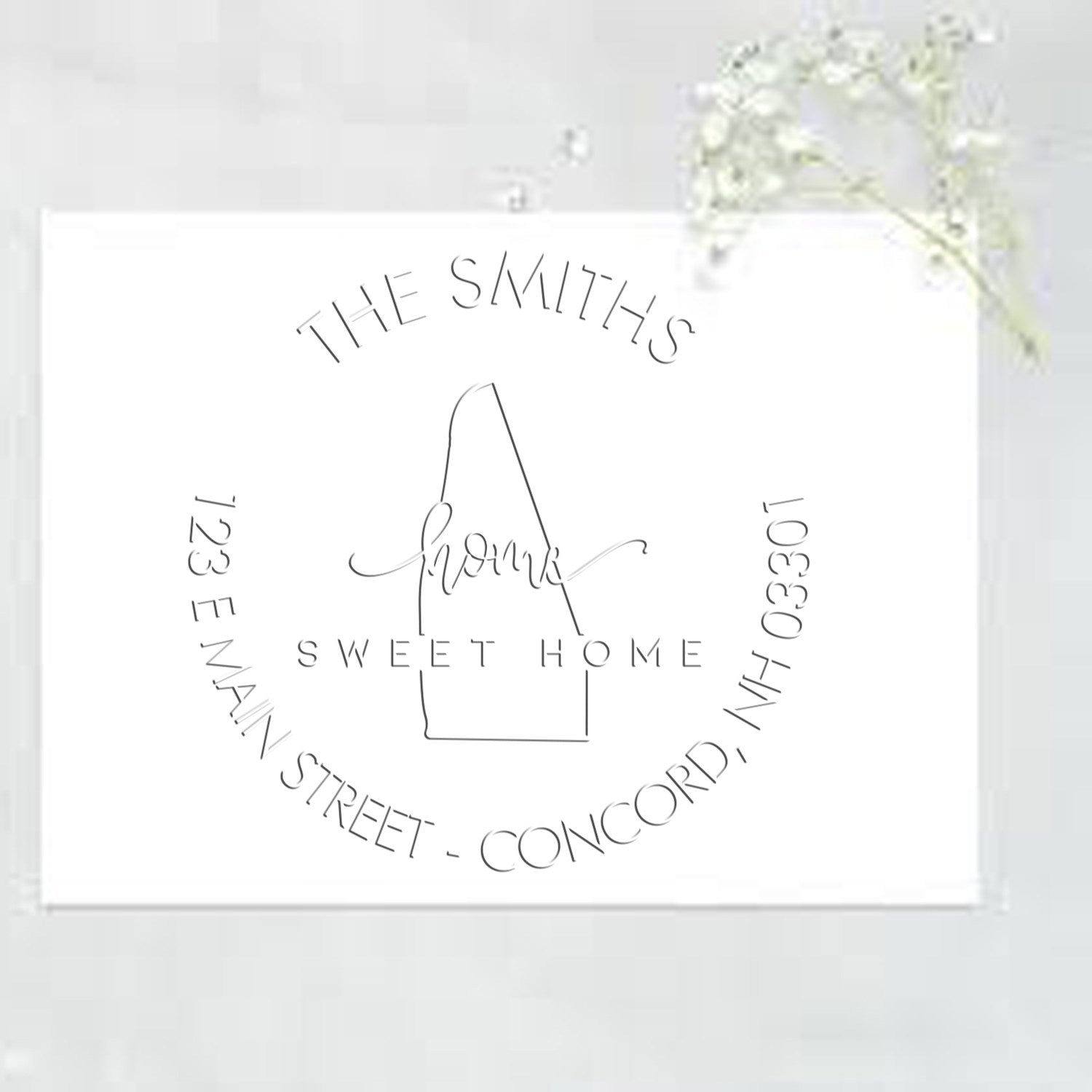 White stamp and seal card with black circular logo, house outline, and The Smiths Sweet Home text on a white background.