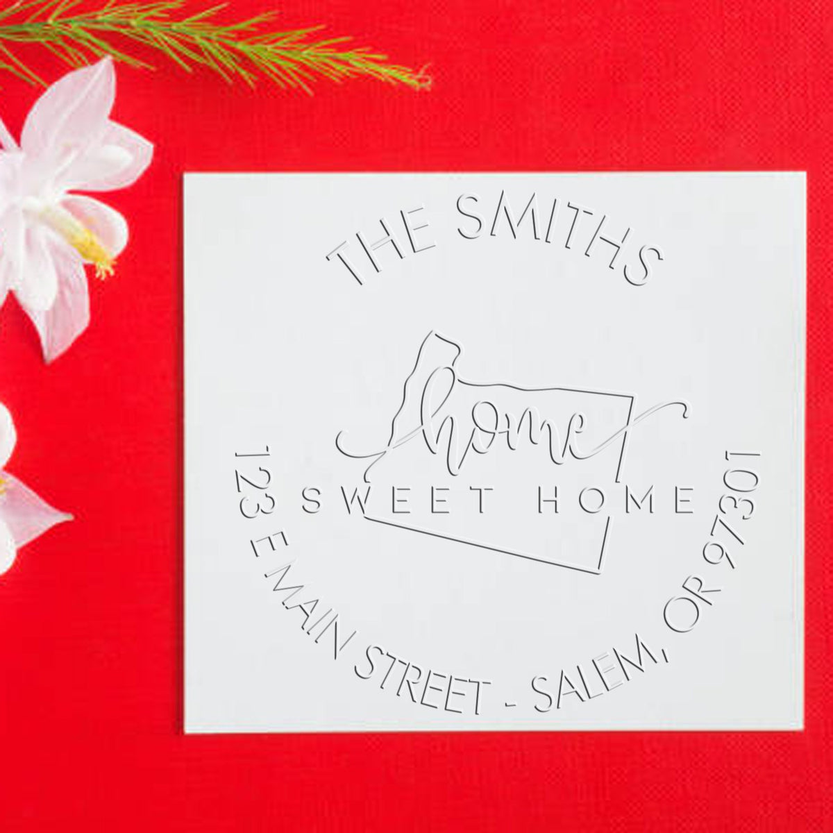 Shiny Sweet Home OR state love mailing address embossed seal, showcasing intricate design on embossed stamp in use.