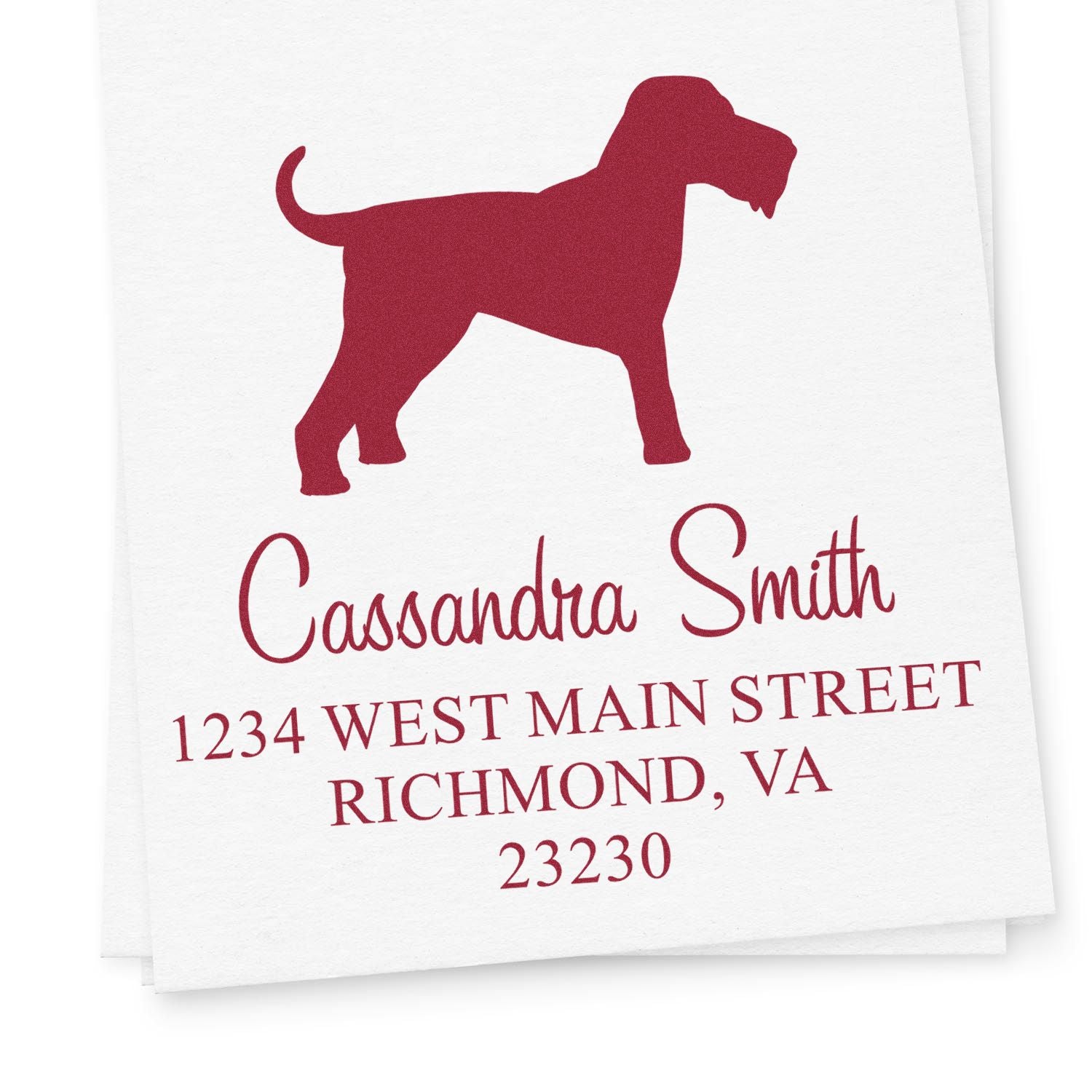 Maroon custom address stamp with dog silhouette, name, street address, city, and ZIP on white paper