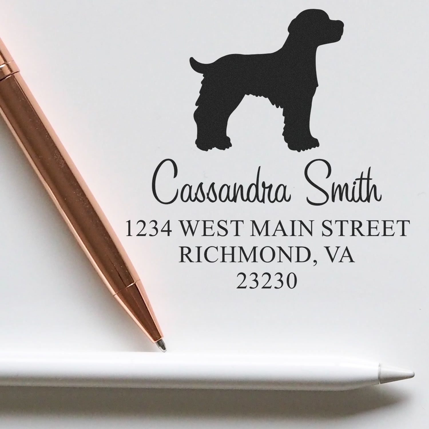 ESS Wood Handle Brittany Spaniel dog stamp in use, showing detailed rubber stamp image of a Brittany Spaniel for address return marking