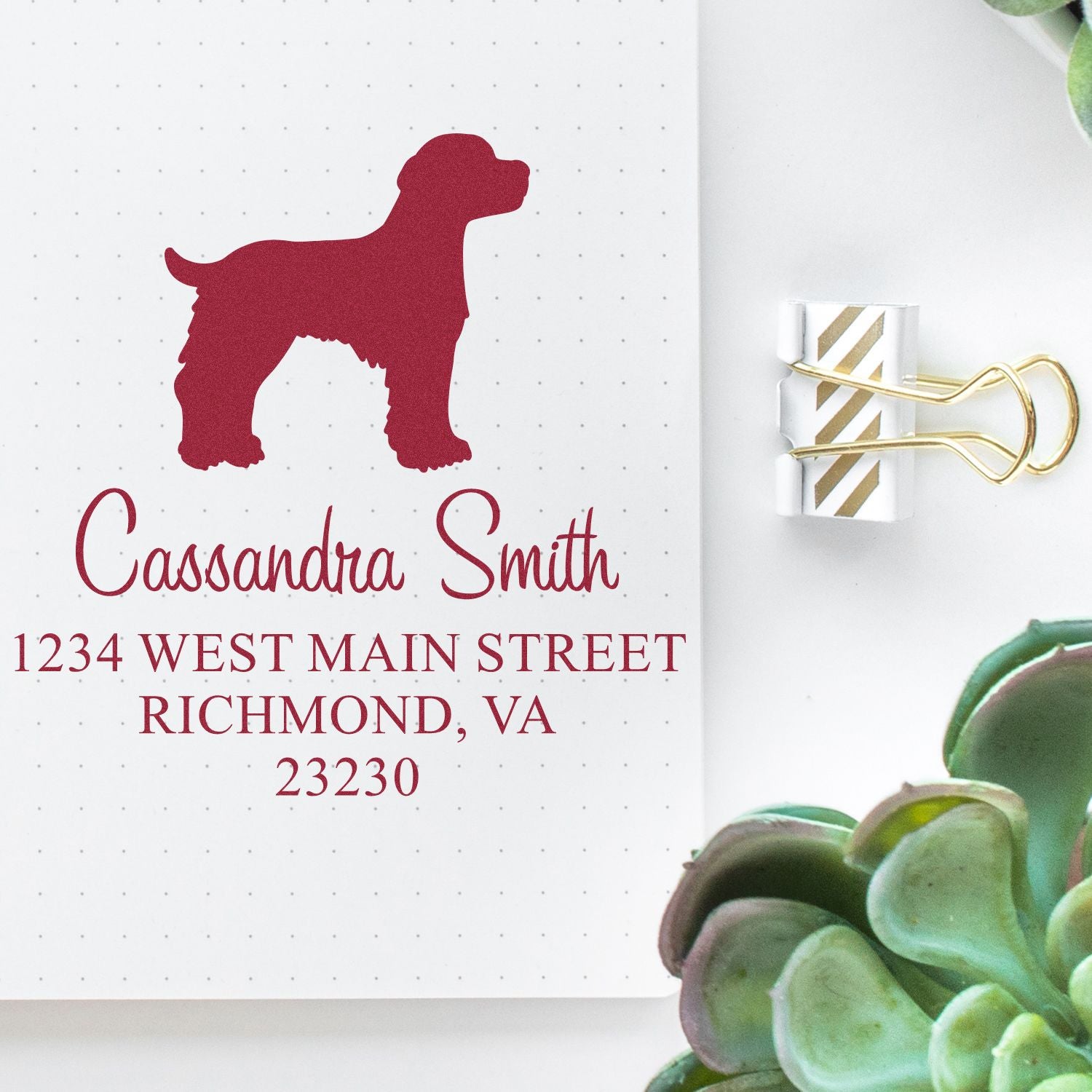 Wood handle Brittany Spaniel dog stamp by ESS in use, featuring detailed image of the rubber stamp with Brittany Spaniel design.