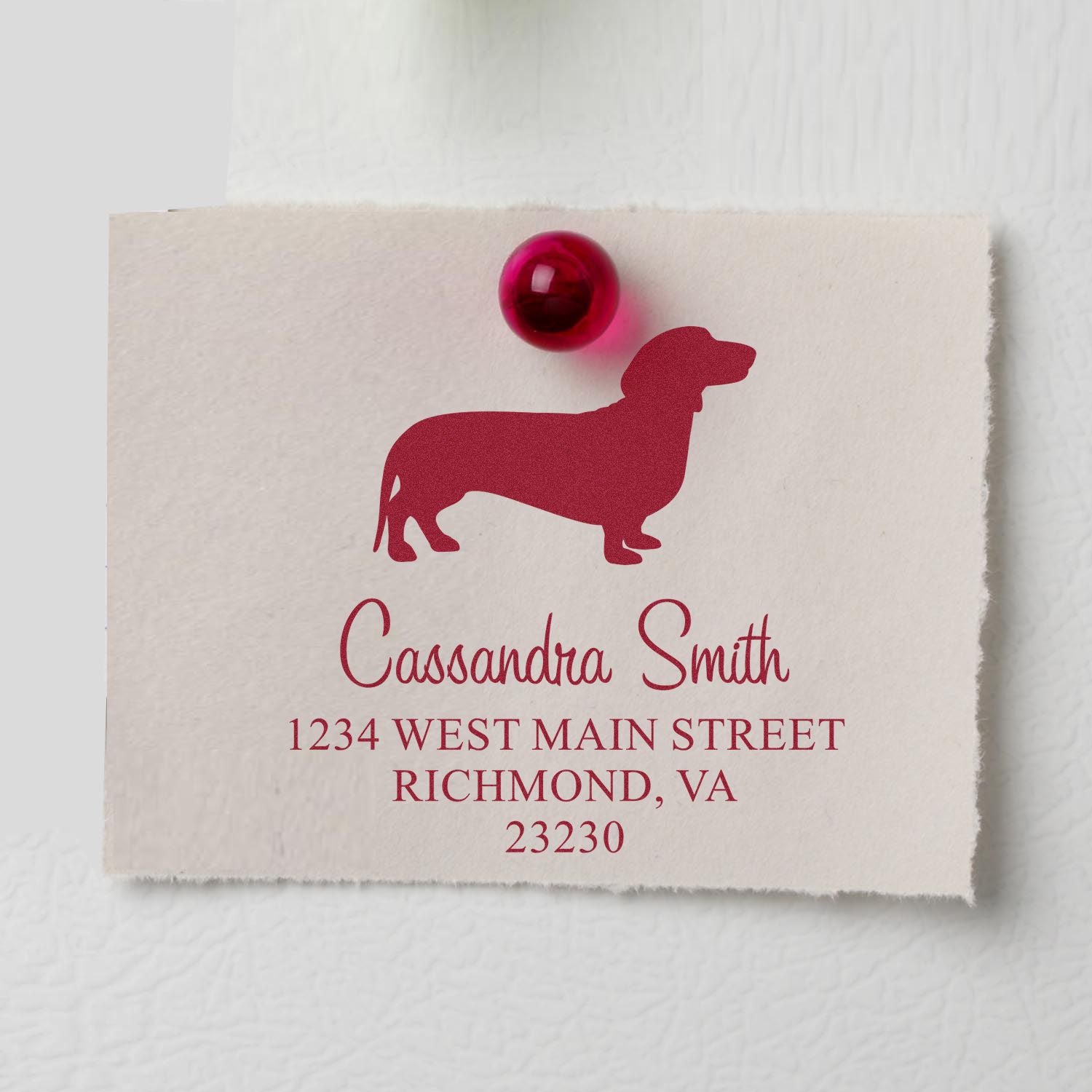 Burgundy dog address stamp on cream paper with matching red wax seal