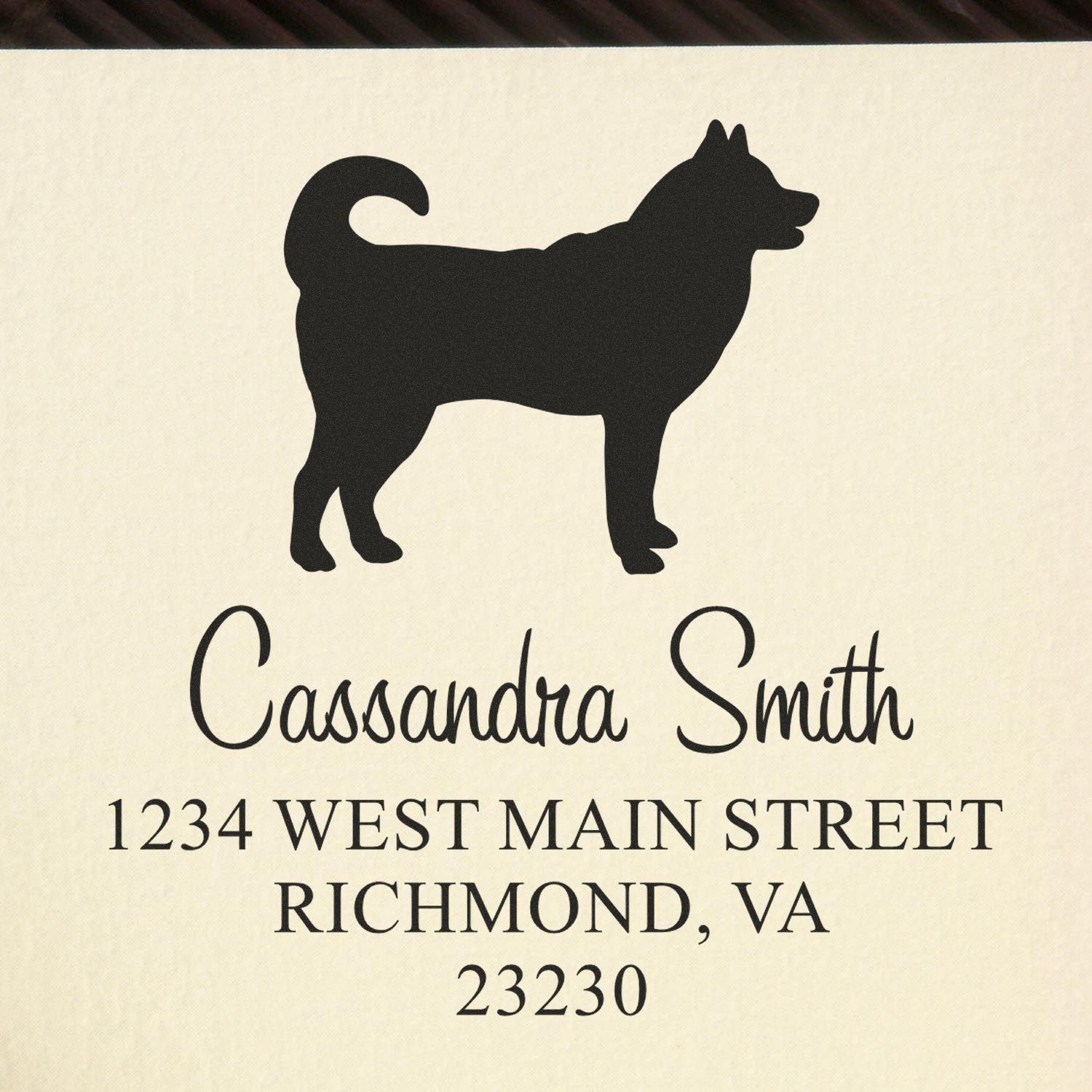 Black dog address stamp on cream background with Cassandra Smith and Richmond, VA mailing address.