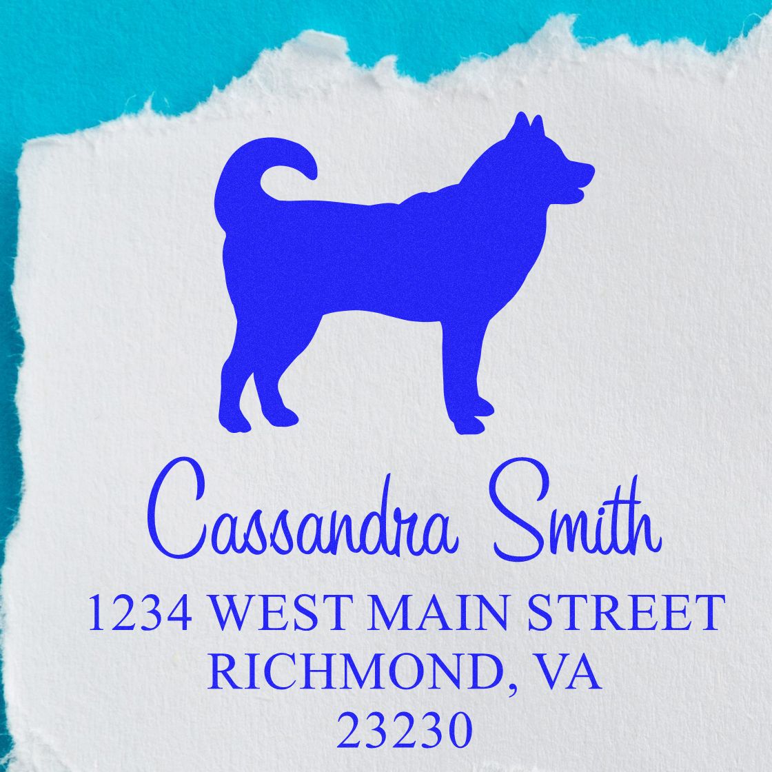 Blue dog silhouette custom address stamp seal on white torn paper with Cassandra Smith and Richmond, VA text