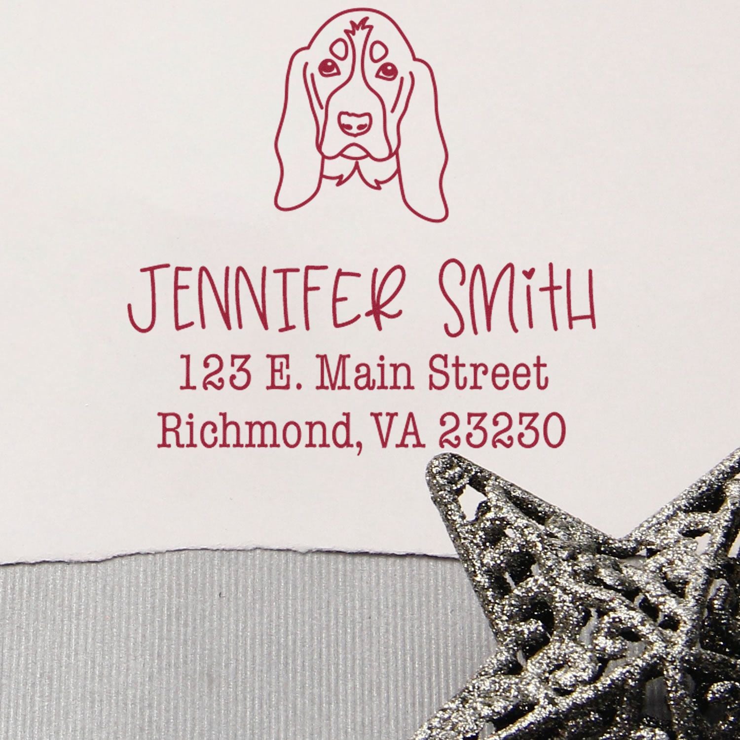 Burgundy custom address stamp with dog logo, Jennifer Smith text, and silver glitter star seal