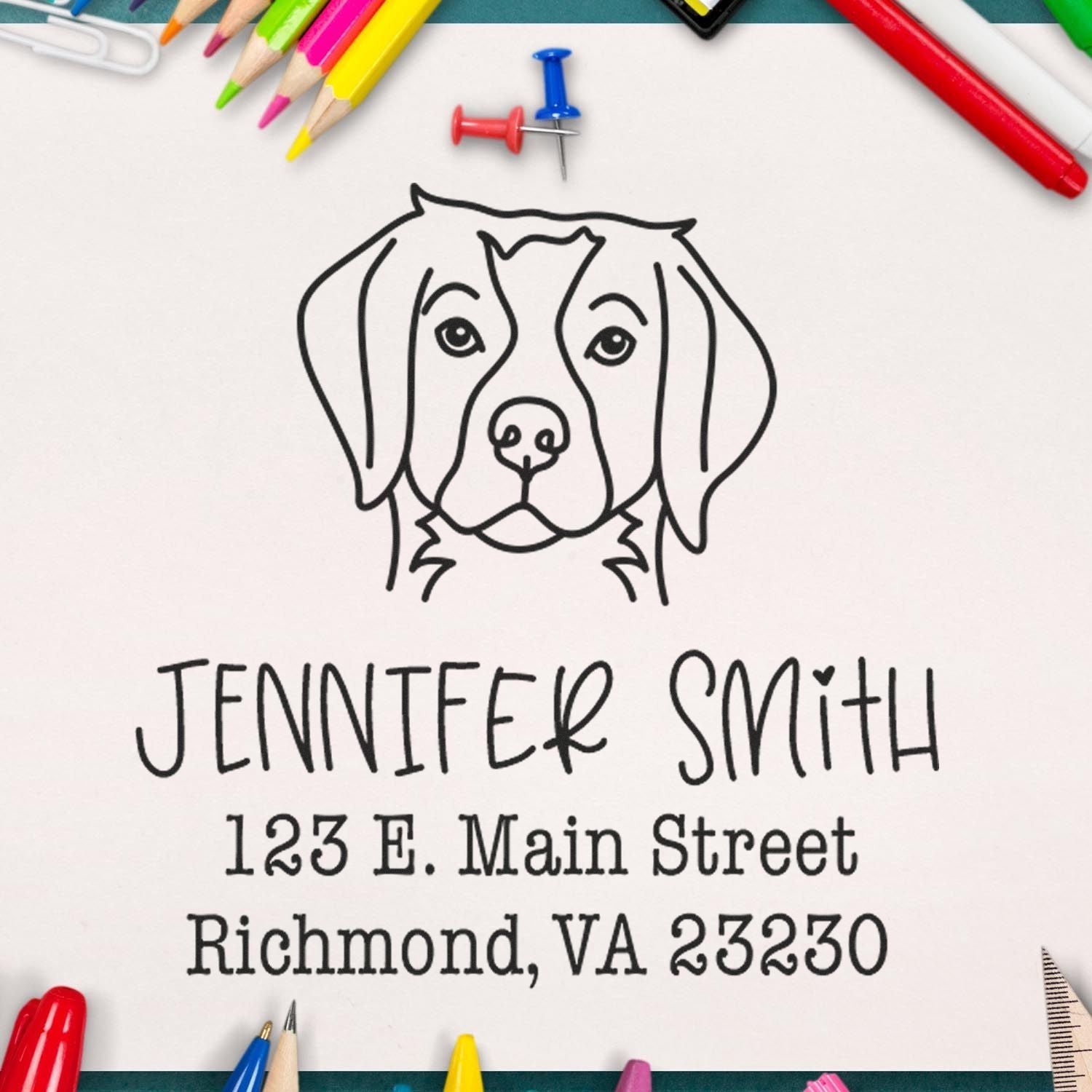 Wood handle Brittany Spaniel dog stamp by ESS in use, featuring a detailed rubber stamp of a Brittany Spaniel for custom address printing.