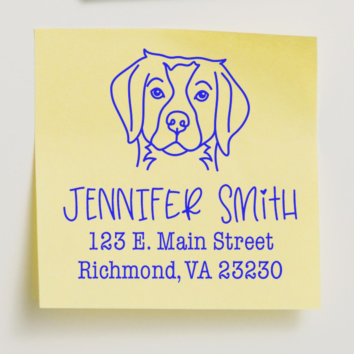 Brittany Spaniel dog stamp with wood handle and custom address design by ESS, in use on paper.