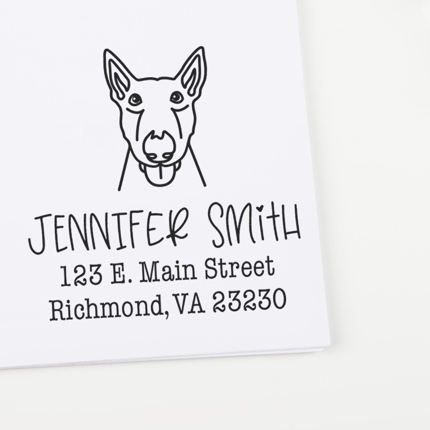 Custom black rubber address stamp with dog head logo, Jennifer Smith, 123 E. Main Street, Richmond, VA 23230