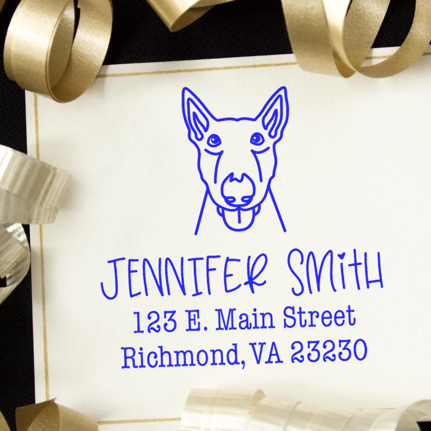 Blue custom stamp and seal with dog logo and Jennifer Smith address on cream paper, framed by gold ribbon.