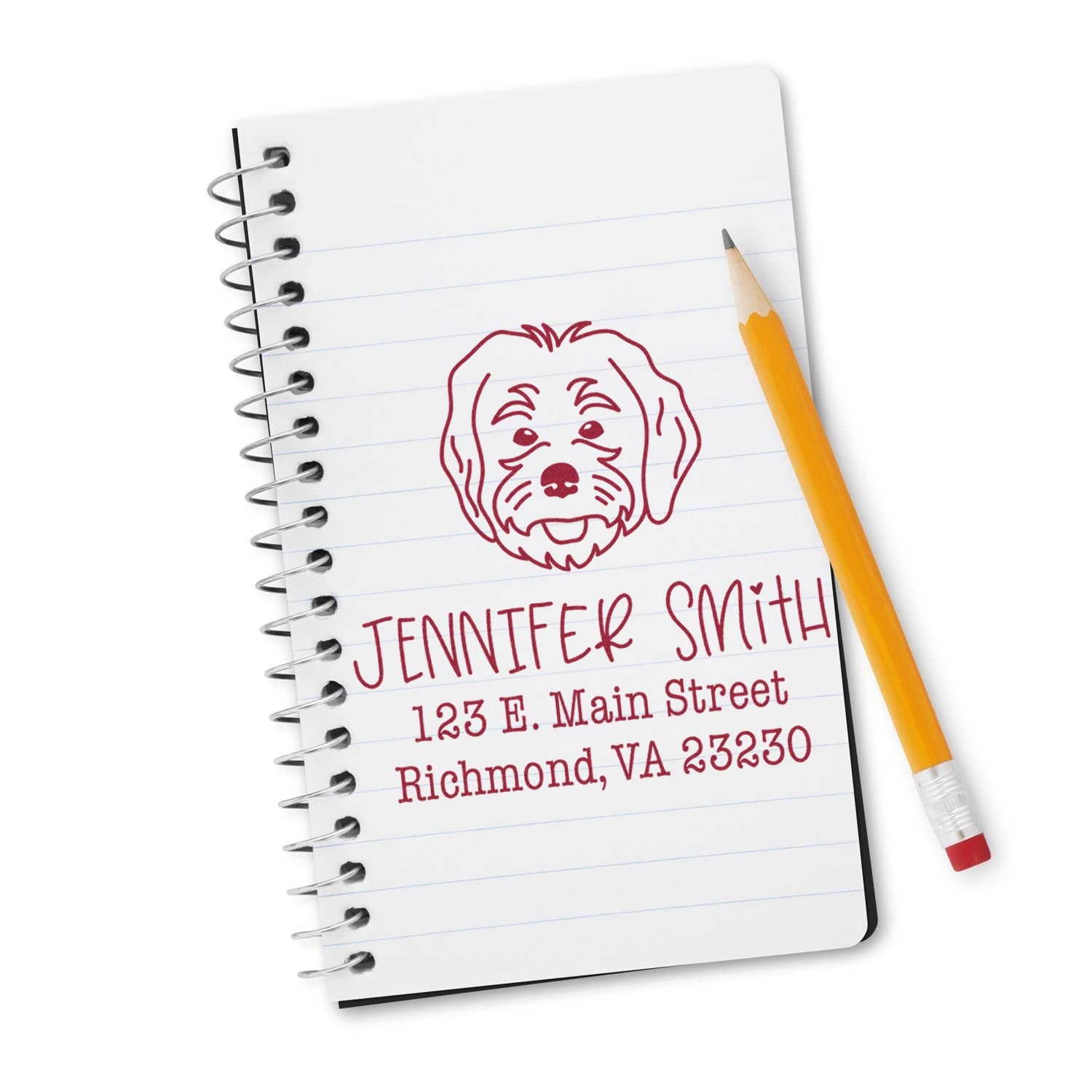Custom burgundy dog address stamp and seal on spiral notebook with yellow pencil, white background