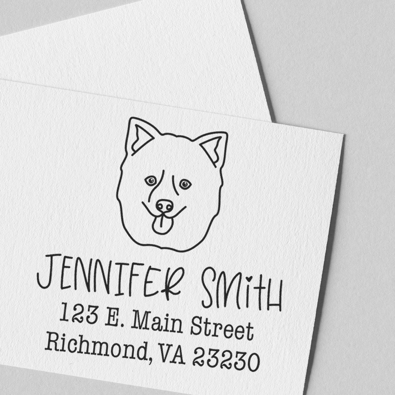Black custom dog seal address stamp on white textured card for Jennifer Smith, Richmond, VA.
