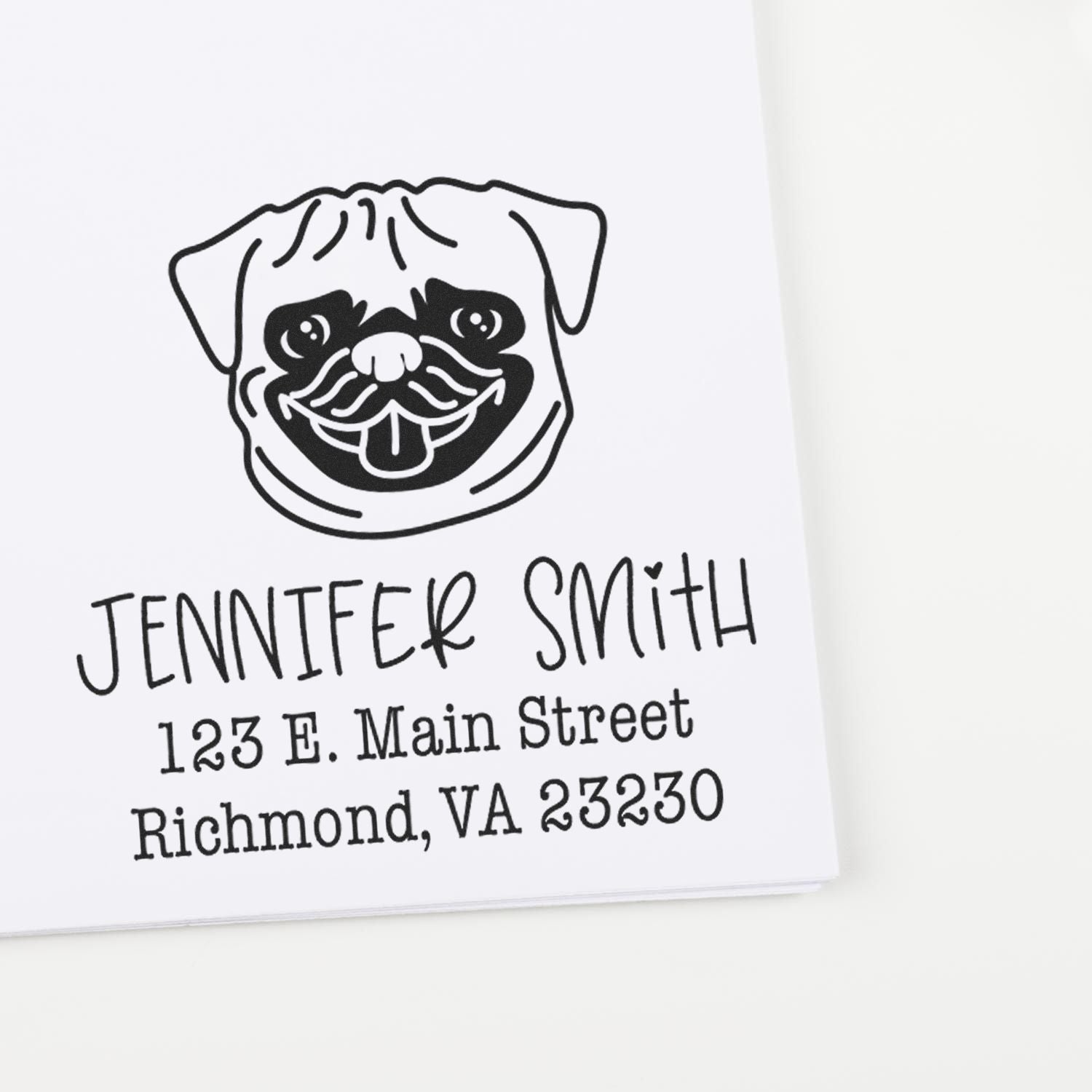 Black custom return address stamp with a pug face logo, Jennifer Smith name, and Richmond, VA address on white paper.