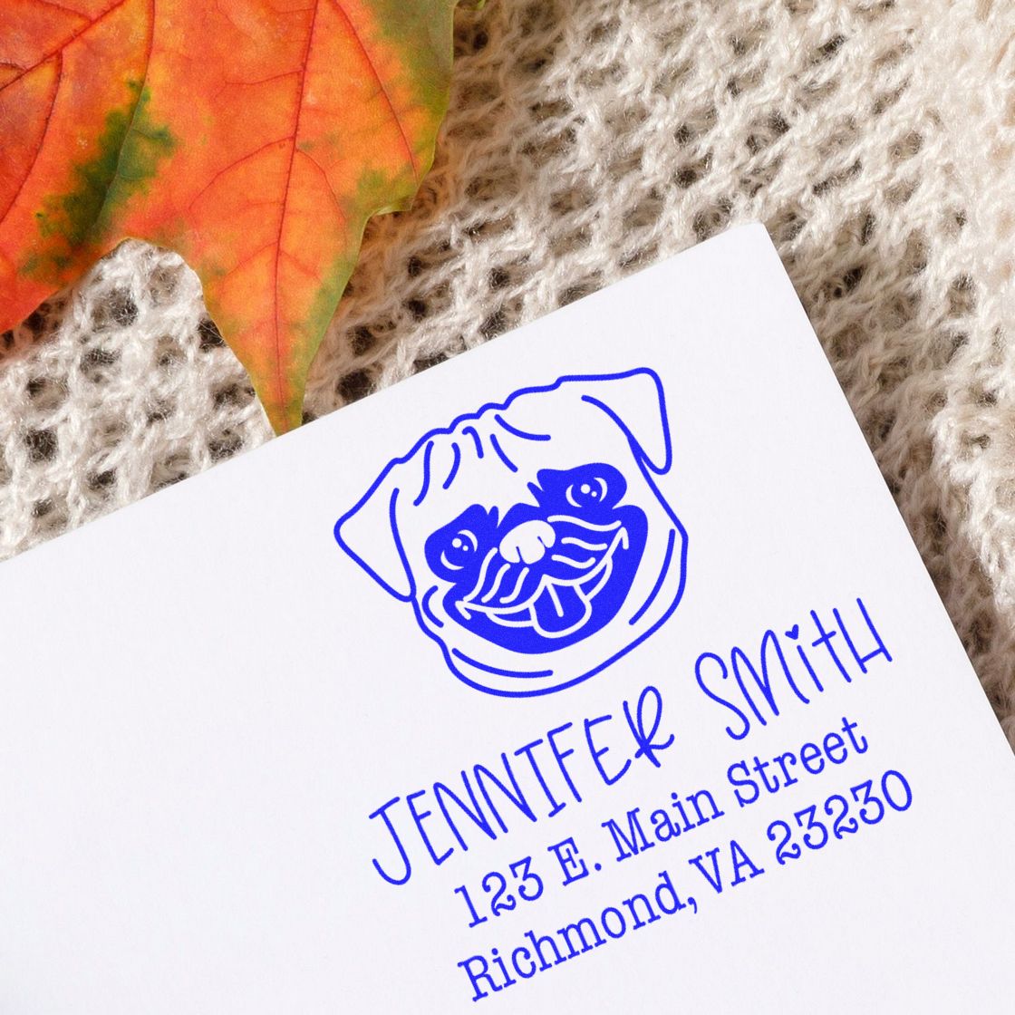 Blue custom stamp and seal with pug logo and Jennifer Smith address on white paper.