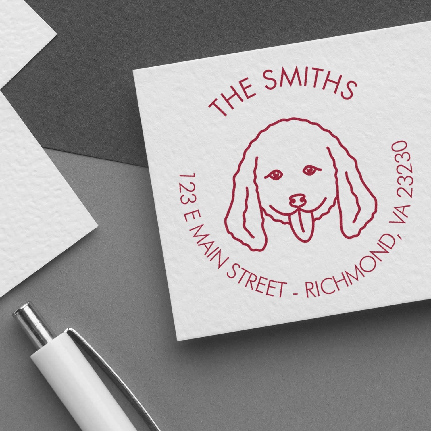 ESS Wood Handle Doodle Dog Address Rubber Stamp in use, showing detailed custom doodle design on stamp surface.