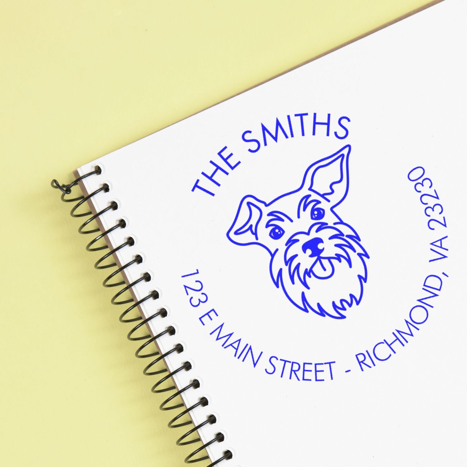 Custom wood handle Schnauzer dog rubber stamp by ESS showing the stamp in use with a Schnauzer design.