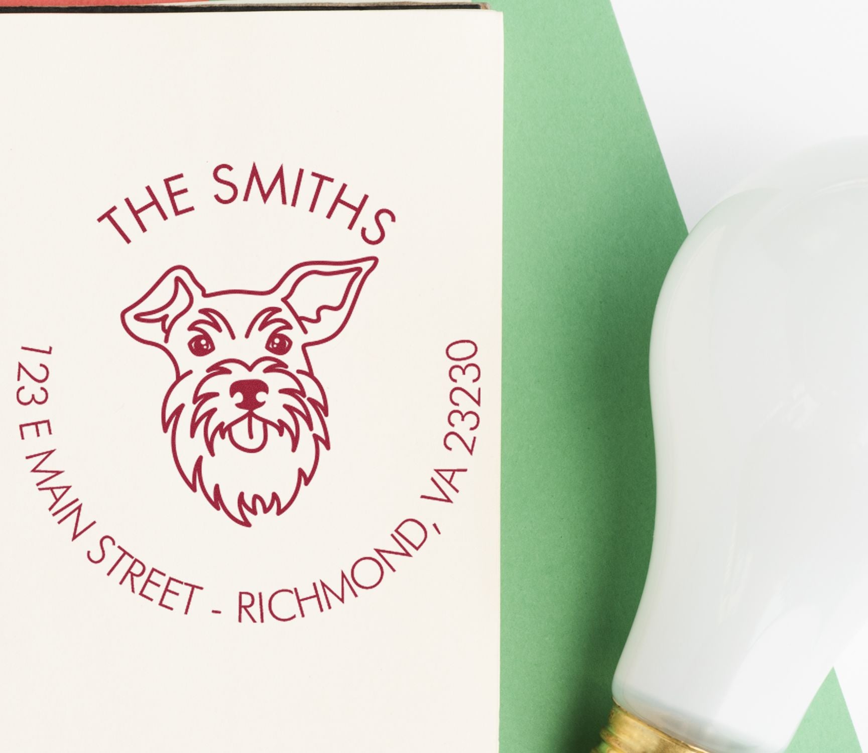 Custom wood handle Schnauzer dog rubber stamp by ESS, showing the stamp in use with Schnauzer design on paper.