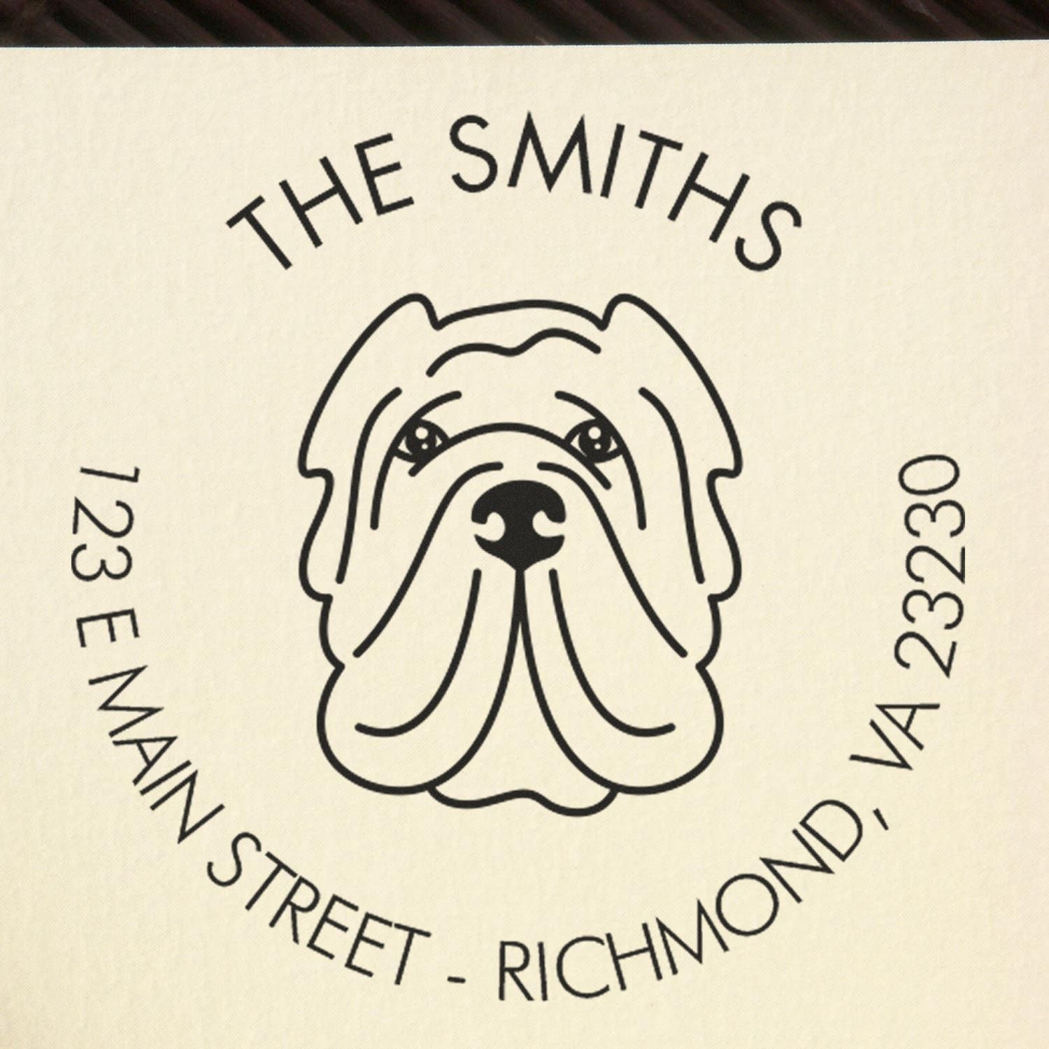 Black bulldog stamp and seal for The Smiths, 123 E Main Street, Richmond, VA 23230, on a cream background.