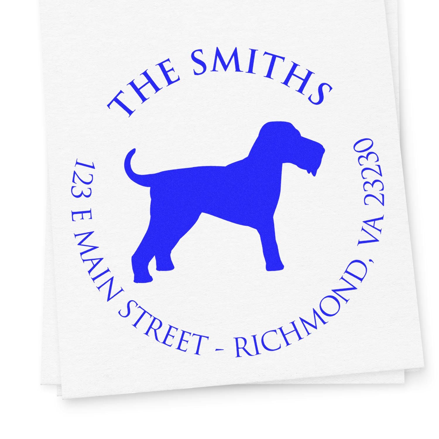 Blue custom dog address stamp and seal reading The Smiths, 123 E Main Street, Richmond, VA 23230 on white paper.