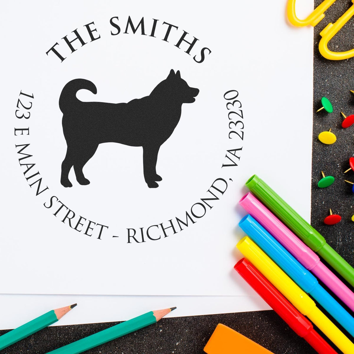 Custom stamp and seal with black dog silhouette, THE SMITHS, 123 Main Street, VA 23230, on white paper with colorful markers