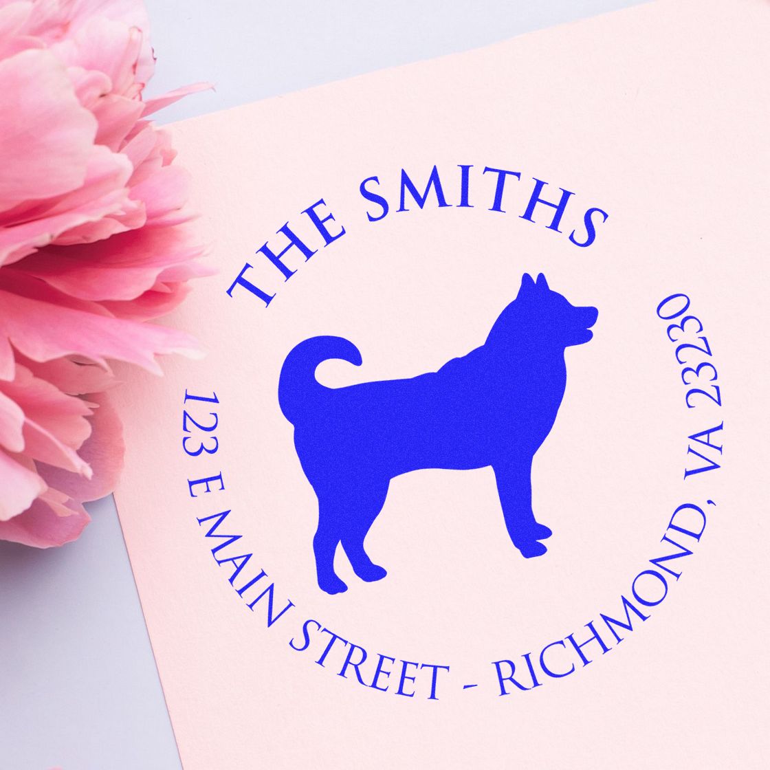 Custom blue dog stamp seal on pale pink paper, with THE SMITHS and Richmond, VA address.