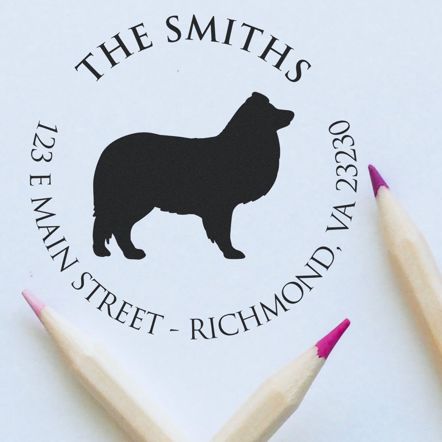 Custom black bear address stamp and seal with circular black text and pink pencil tips on a white background.