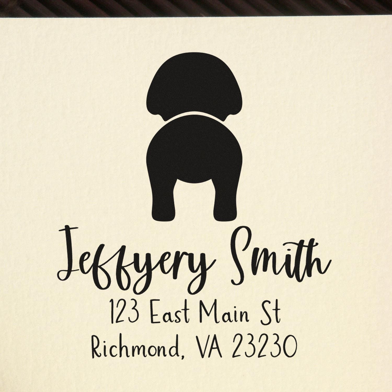 Black custom return address stamp and seal for Jeffrey Smith, with monogram and address, 123 East Main St, Richmond, VA 23230.