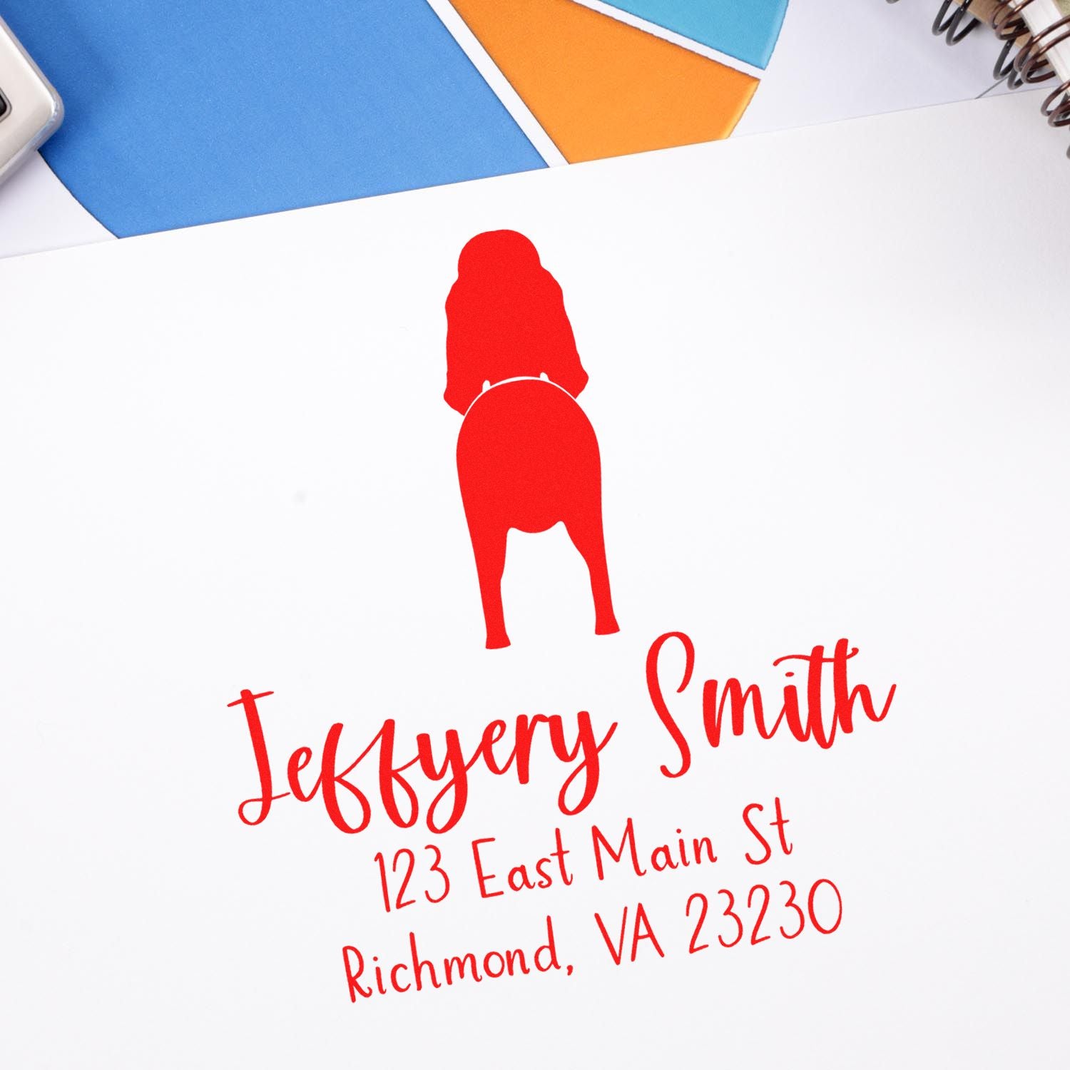 Red custom stamp seal with dog silhouette and Jeffery Smith address on white paper, with blue and orange swatches.