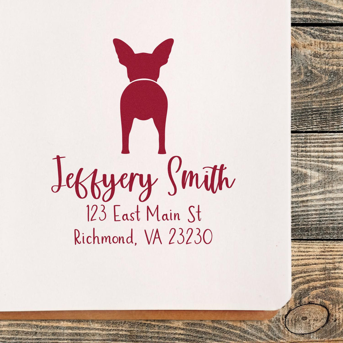 Custom wood handle Chihuahua pet address rubber stamp by ESS featuring a detailed dog design in use.