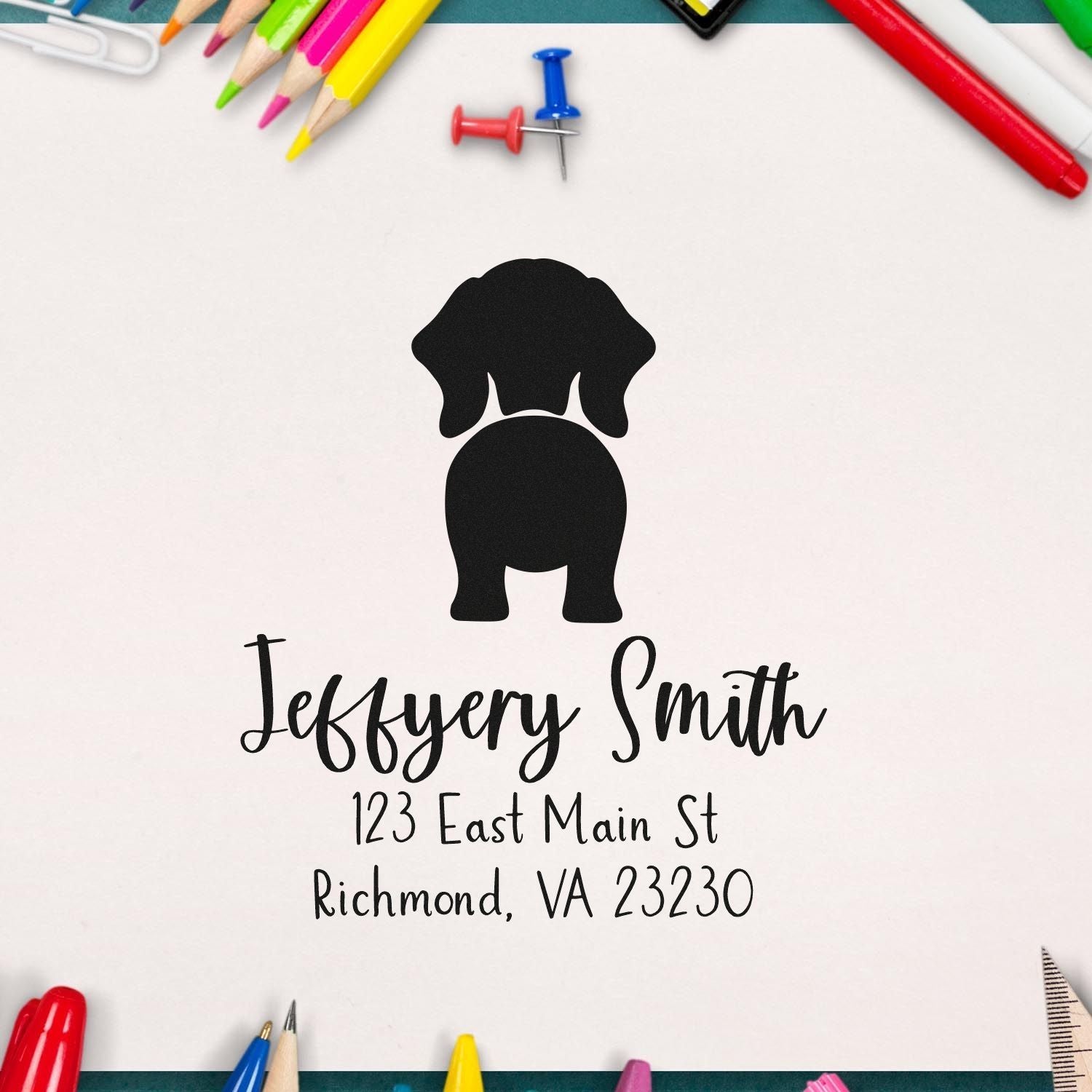 Custom black dog return address stamp with name and Richmond, VA address, framed by colorful pencils and pins on white background.