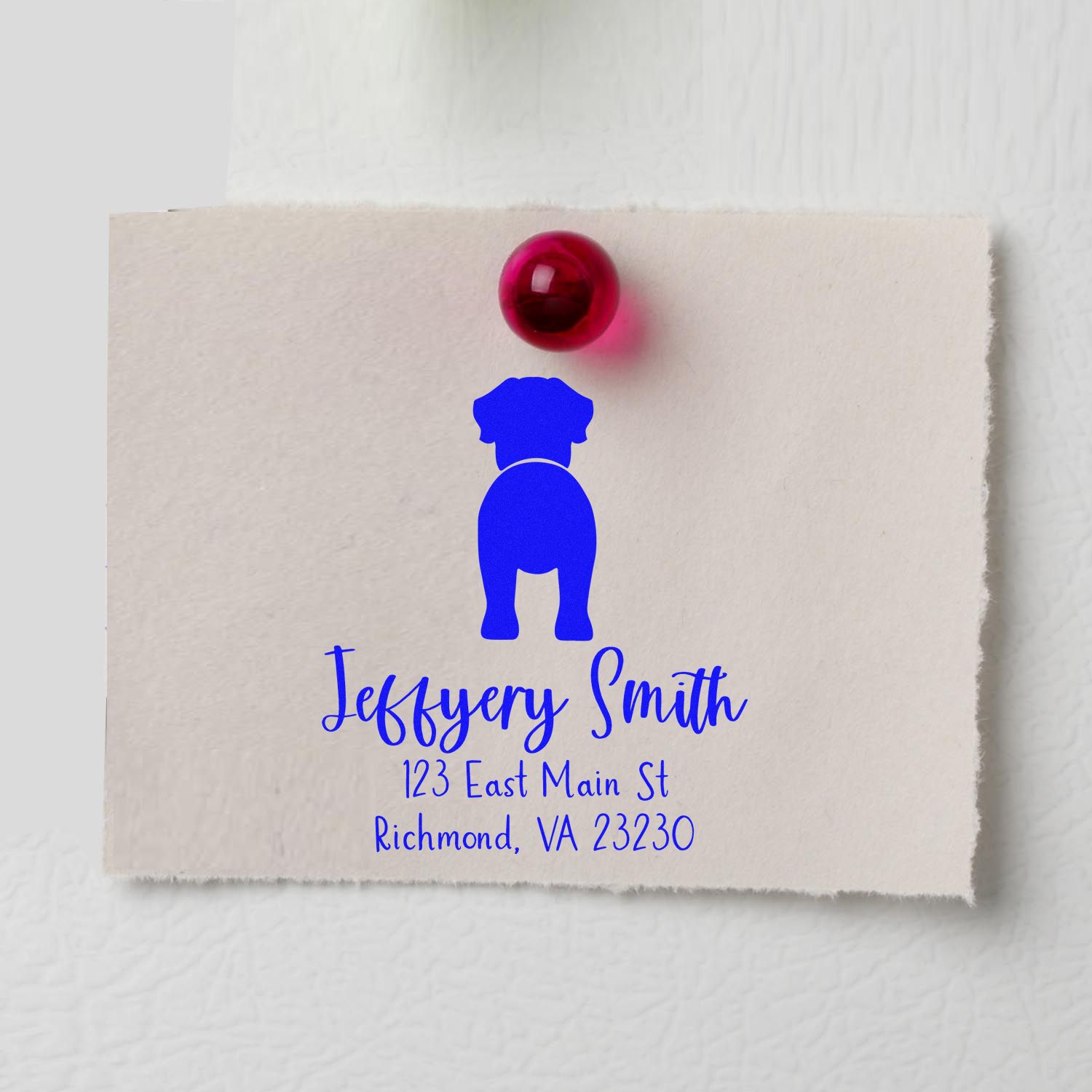 Blue custom dog stamp and seal on cream paper, topped with a red wax seal, with name and address.