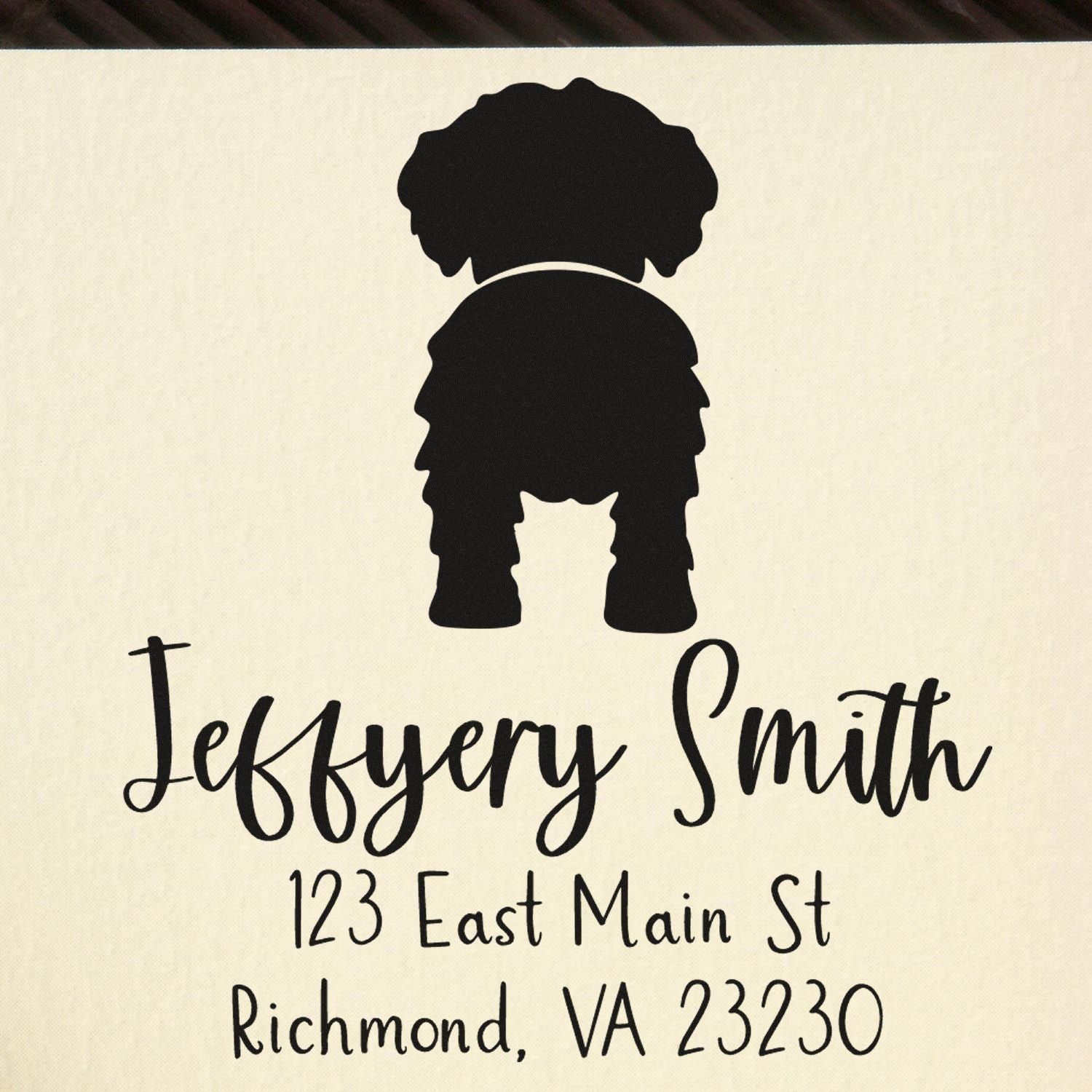 Custom black address stamp with dog silhouette seal, featuring Jeffrey Smith and Richmond, VA 23230 on cream background.