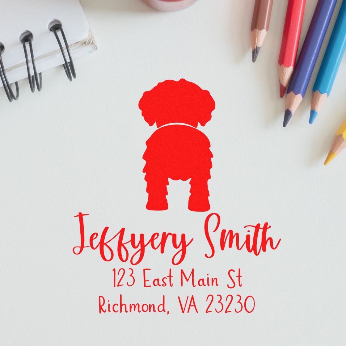 Red custom address stamp and seal for Jeffrey Smith, Richmond, VA 23230, on white paper with colored pencils.