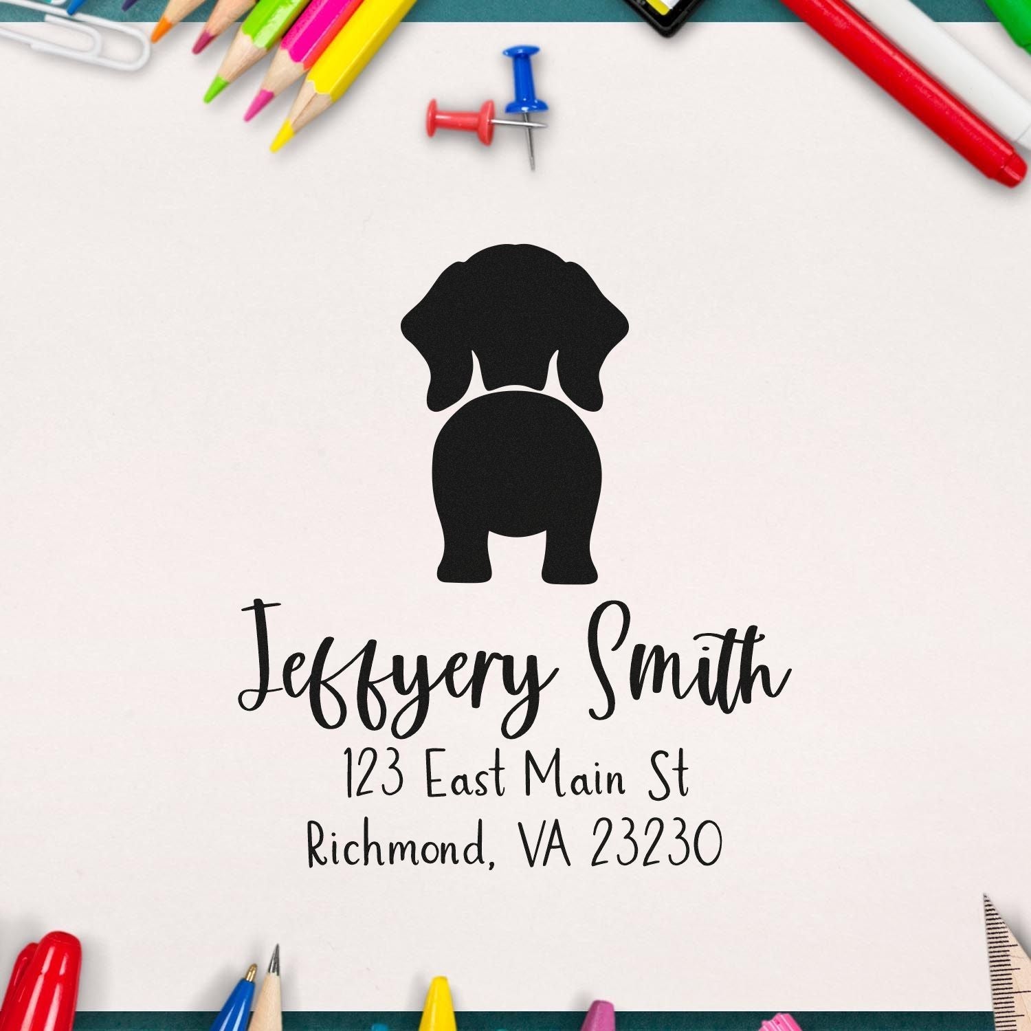 Custom black dog logo address stamp and seal with colorful pencils, pushpins, and white background