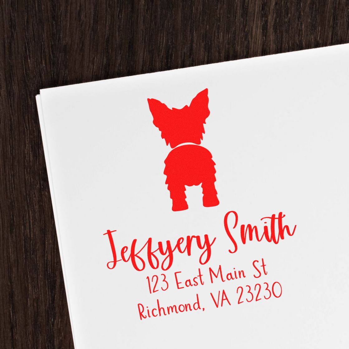 Red custom stamp and seal with dog silhouette, Jeffery Smith, 123 East Main St, Richmond, VA on white paper.