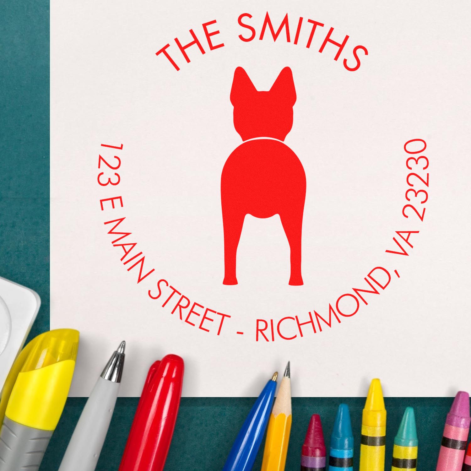 Custom red dog silhouette address stamp seal reading The Smiths, 123 E Main Street, Richmond, VA 23230 on white paper