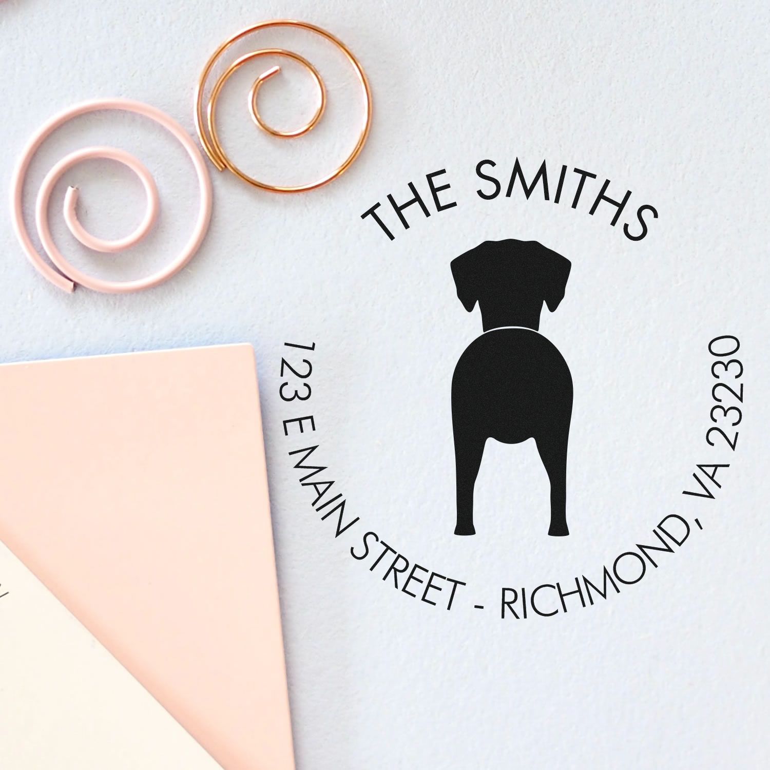 Dog stamp with wood handle featuring Dalmatian design, used for custom pet address marking by ESS.
