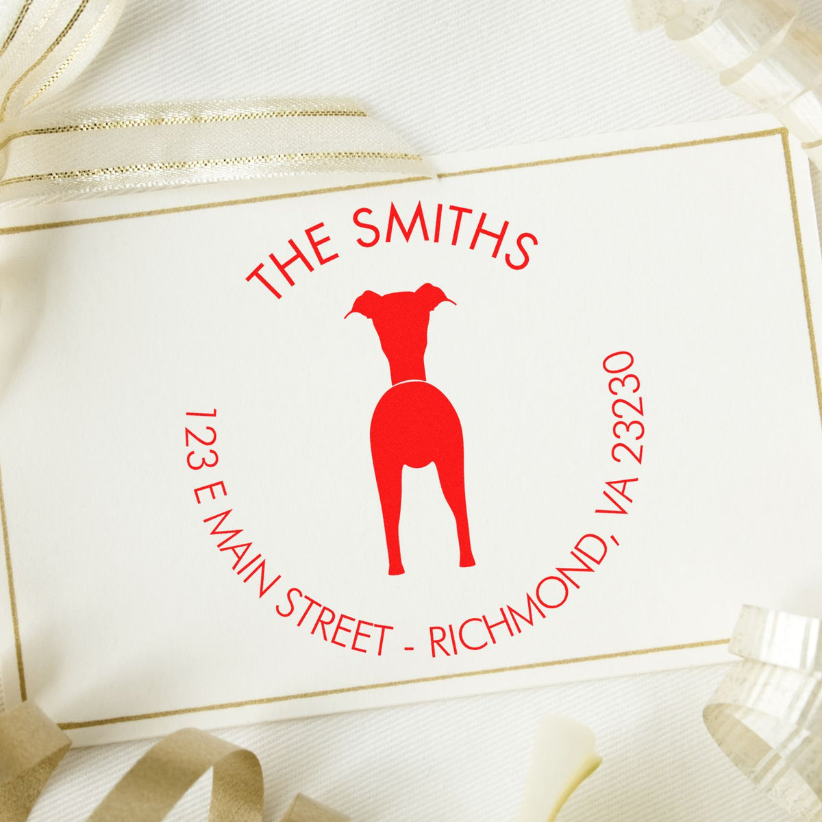 Custom red stamp seal with dog silhouette and THE SMITHS text on white card with gold border and sheer ribbon.