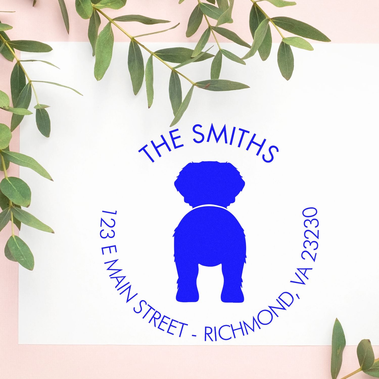 Blue personalized dog logo stamp and seal for The Smiths, with Richmond, VA address on white, framed by green leaves.