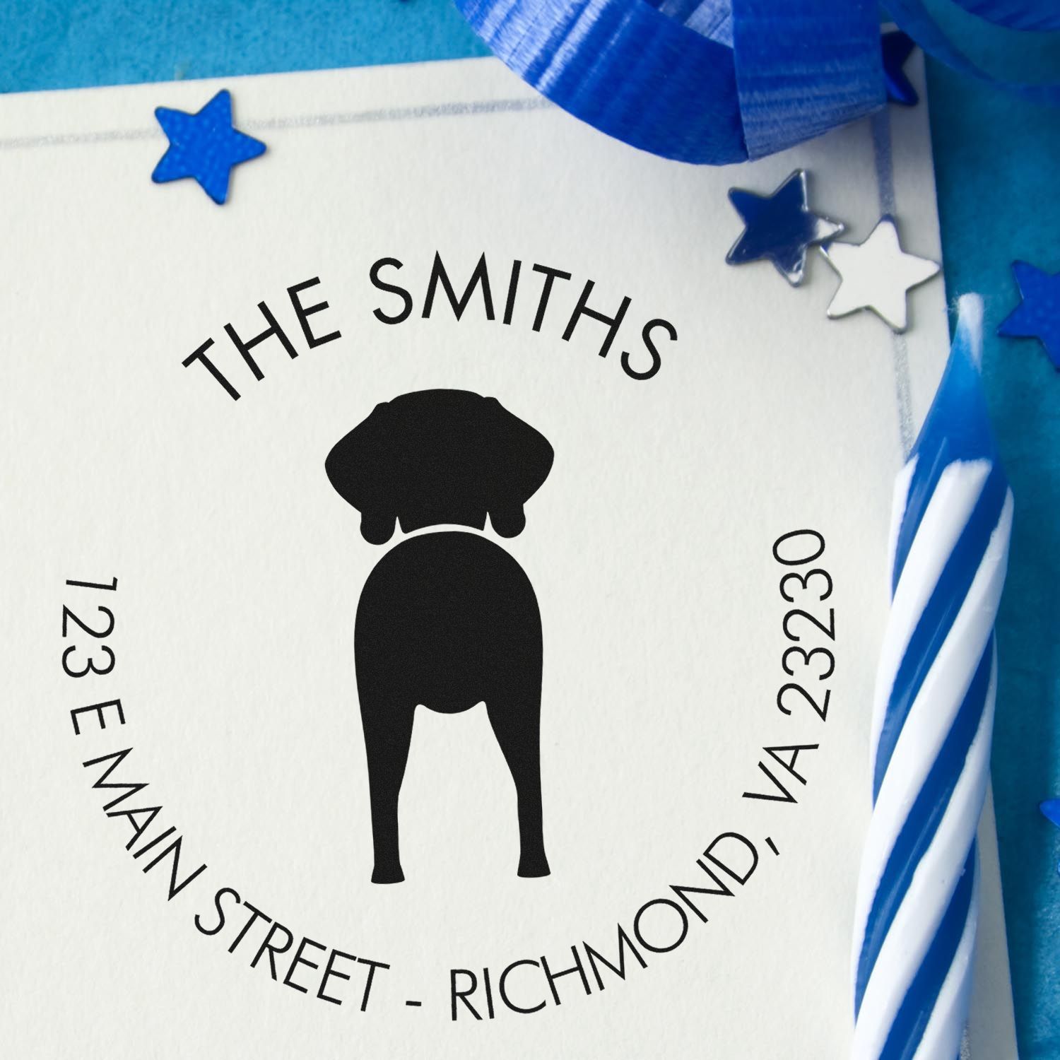 Weimaraner dog-shaped rubber stamp with wooden handle, customizable address return stamp by ESS, in use.