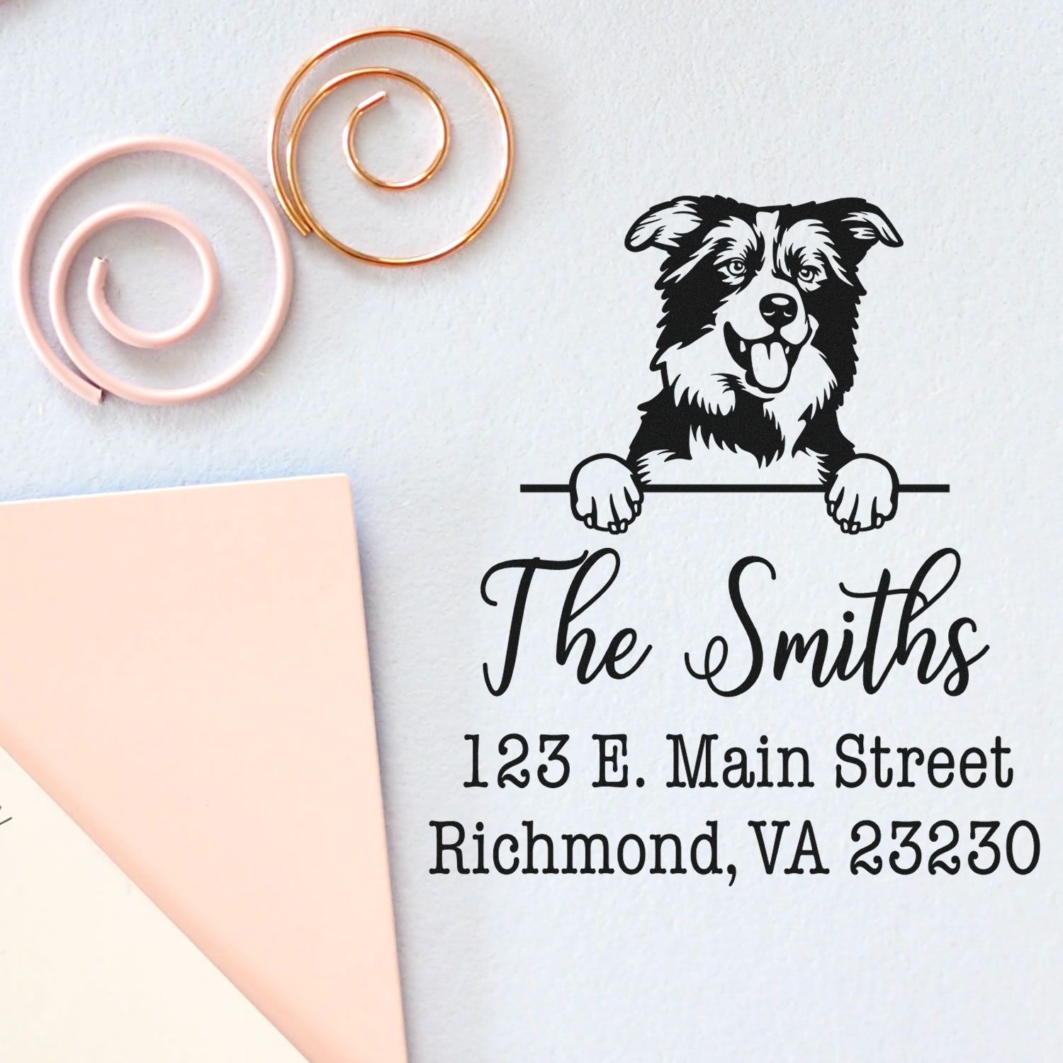 Custom black dog family address stamp with The Smiths, Richmond, VA, beside pink and gold wax seals on white paper.