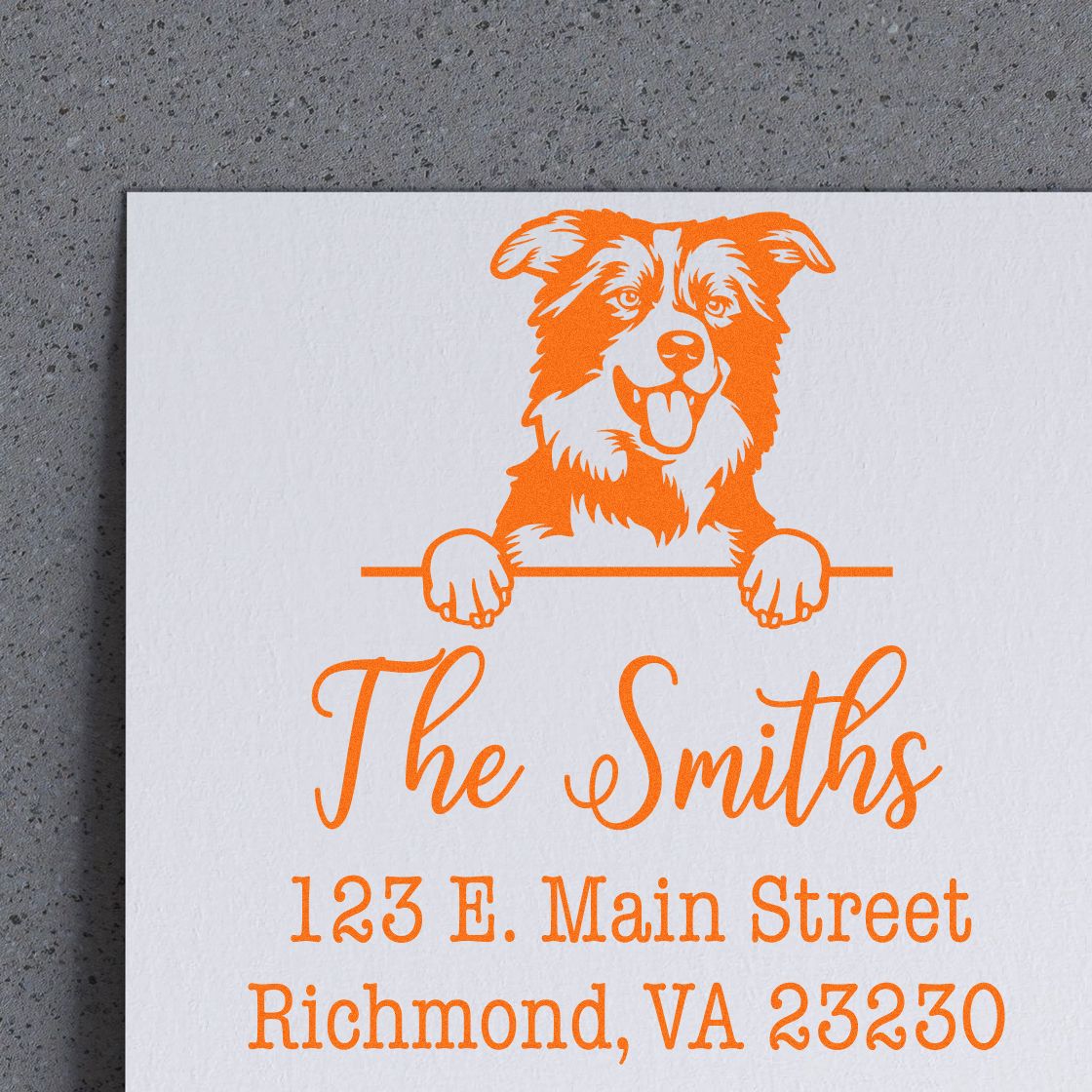 Orange custom stamp and seal with dog mascot for The Smiths, showing 123 E. Main Street, Richmond, VA 23230.