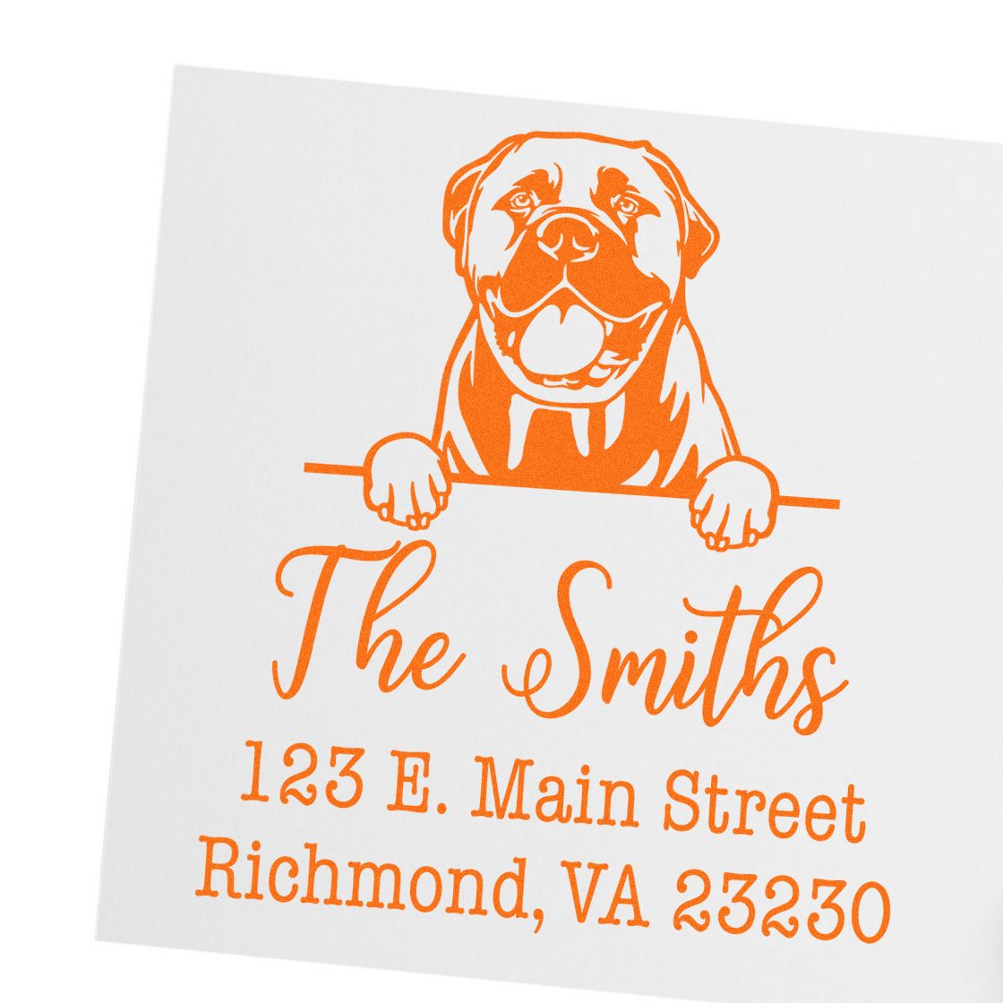 Orange custom address stamp with dog graphic, The Smiths, and Richmond, VA address on white paper.