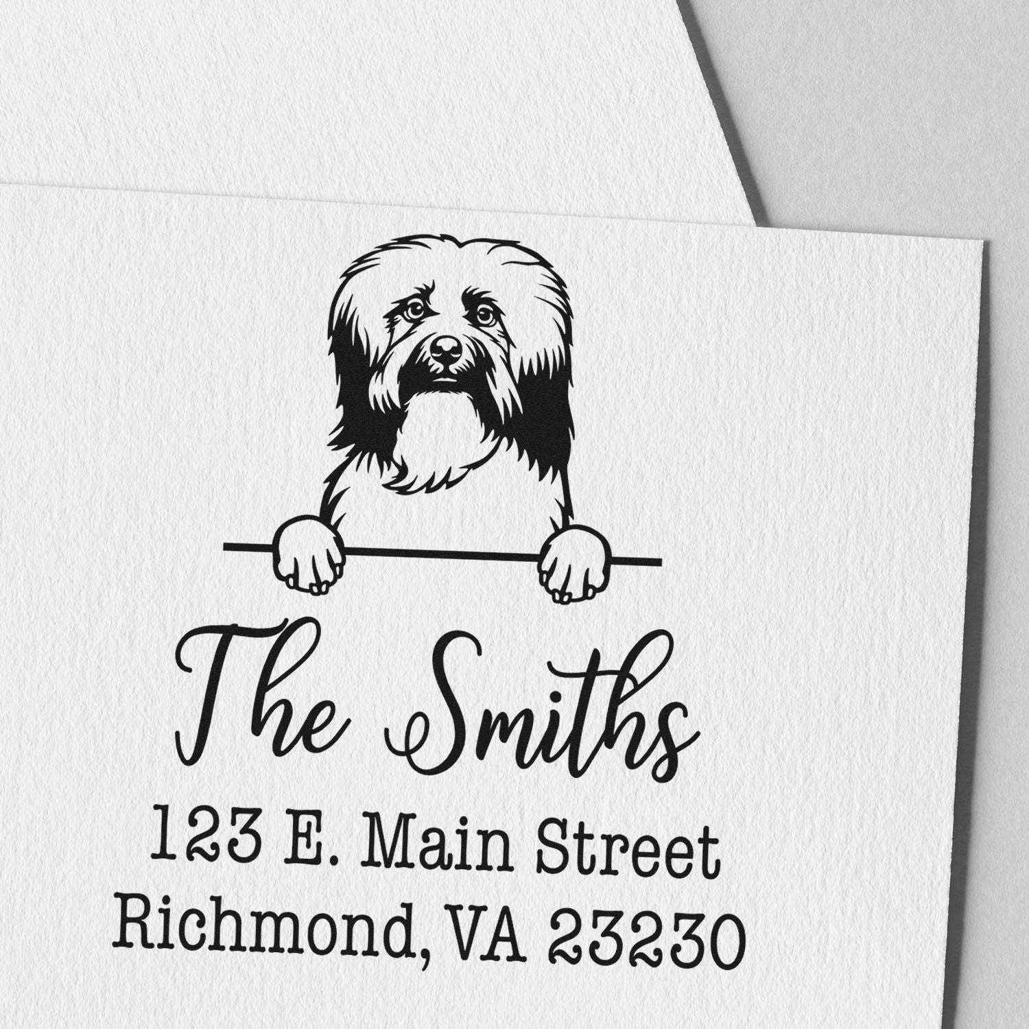 Black-and-white custom stamp seal with dog illustration, The Smiths, and Richmond, VA 23230 on textured white paper.