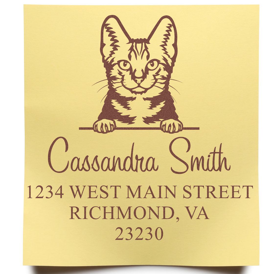 Gold personalized address stamp with brown cat seal, Cassandra Smith, 1234 West Main Street, Richmond, VA 23230.