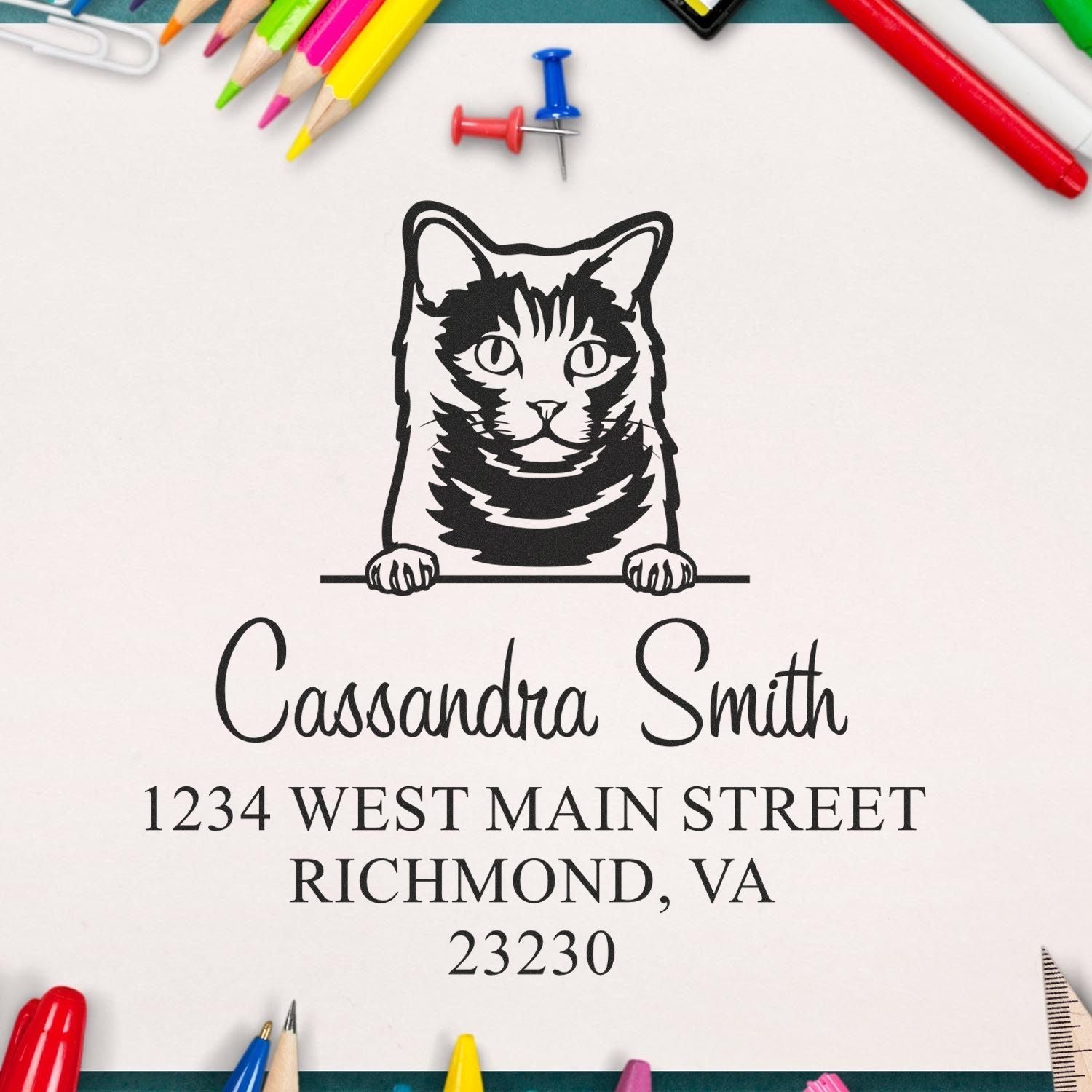 Custom black cat address stamp and seal for Cassandra Smith, Richmond, VA, on white paper with colorful pencils.
