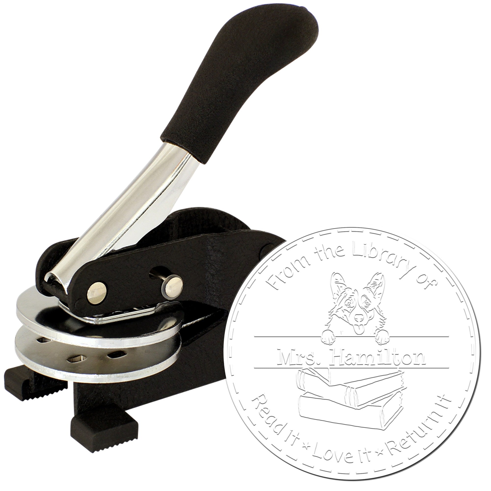 Black handheld embosser stamp with custom library seal featuring a dog, books, and Mrs. Hamilton text.