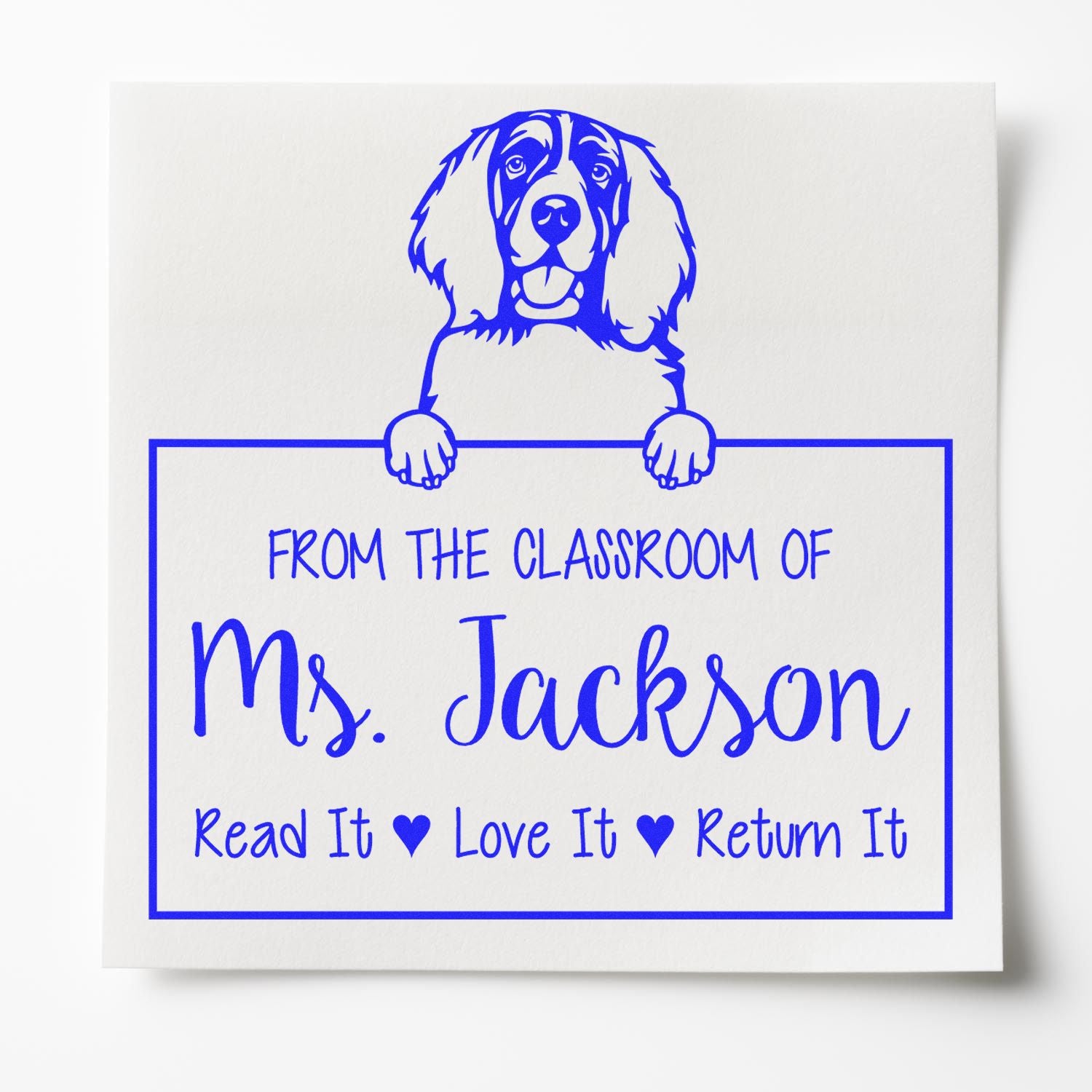 Blue custom classroom stamp seal with dog mascot, Ms. Jackson, and Read It Love It Return It on white.