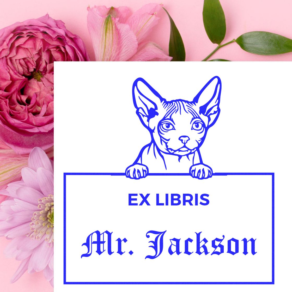 Blue ex libris stamp seal with a Sphynx cat and Mr. Jackson text on a white card, set against pink flowers.
