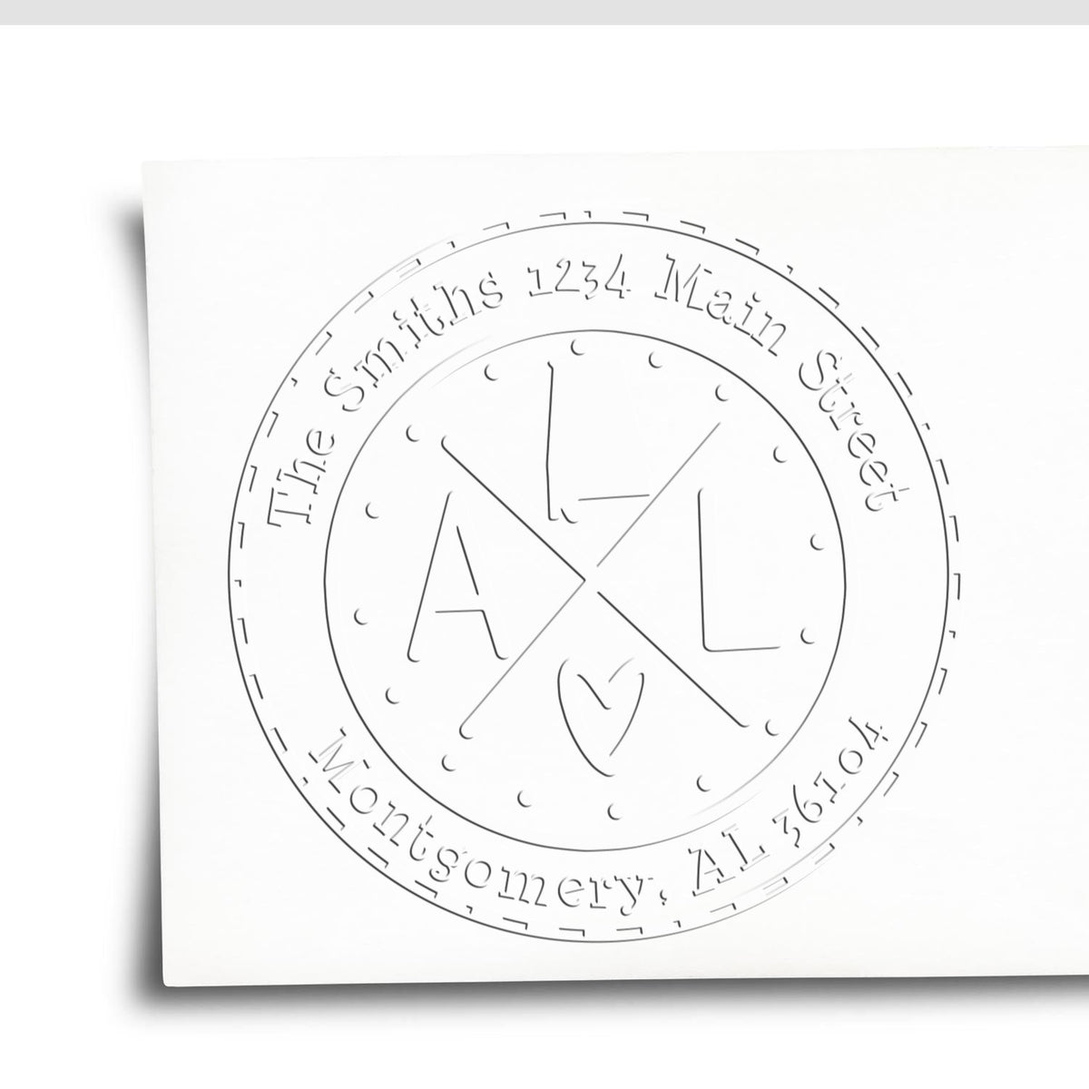 White circular emboss stamp seal with black-gray monogram, The Smiths, and address text around the edge.