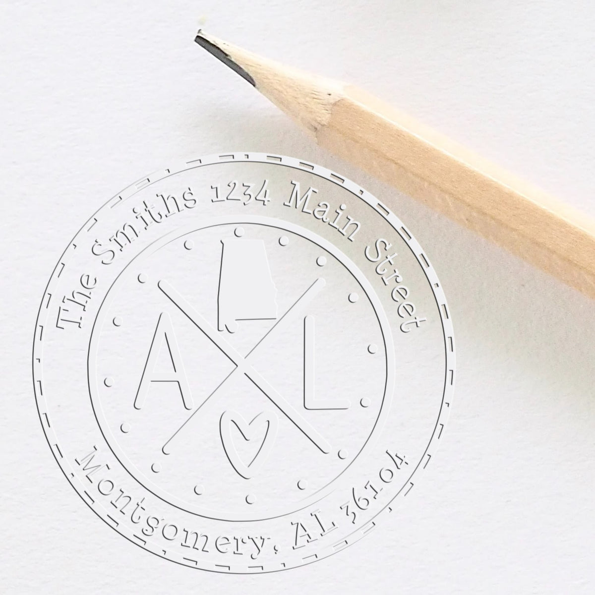 Embossed white stamp seal with pencil, circular logo reading The Smiths 1234 Main Street Montgomery, AL 36104